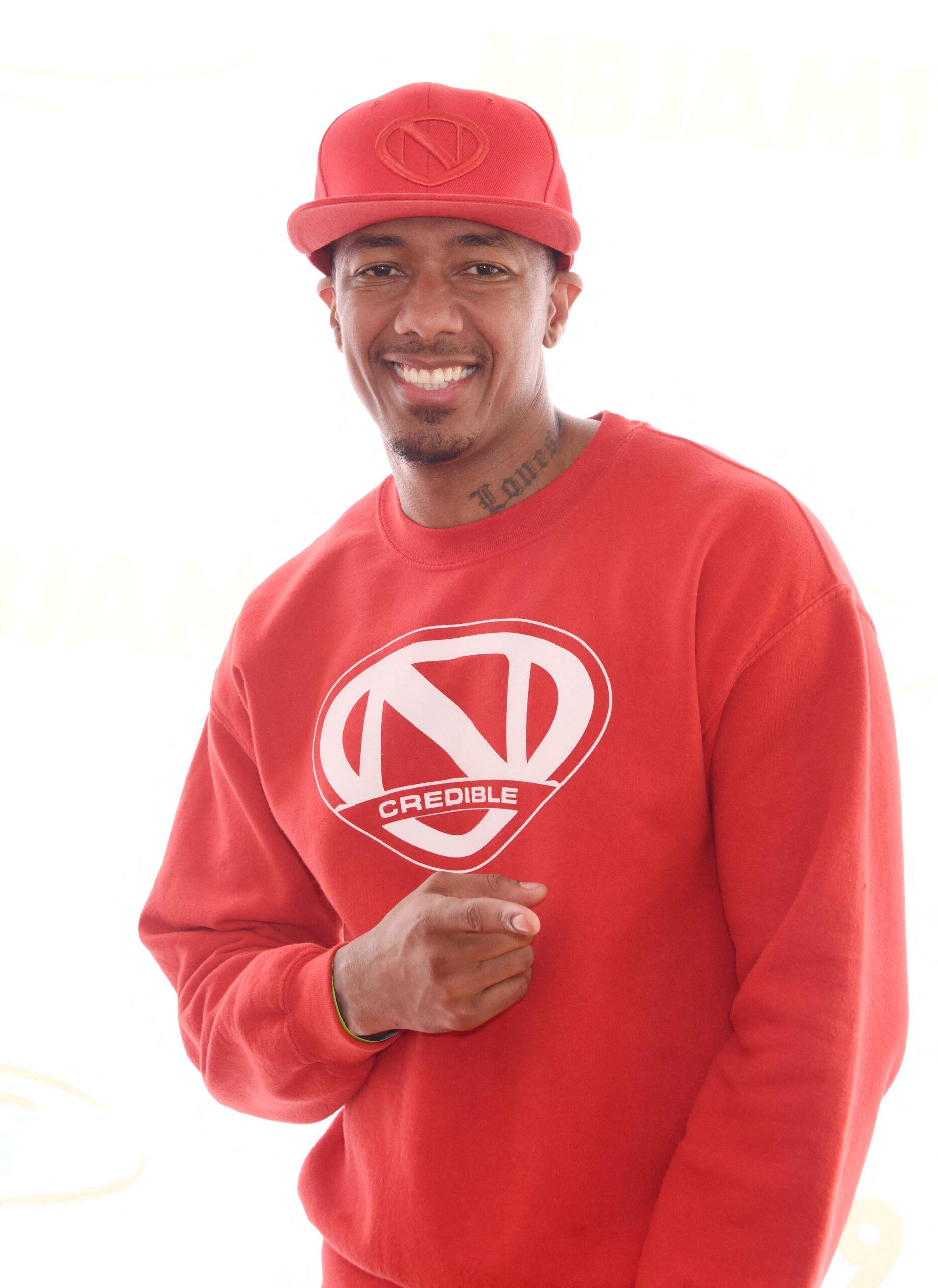 Nick Cannon in a red sweatshirt