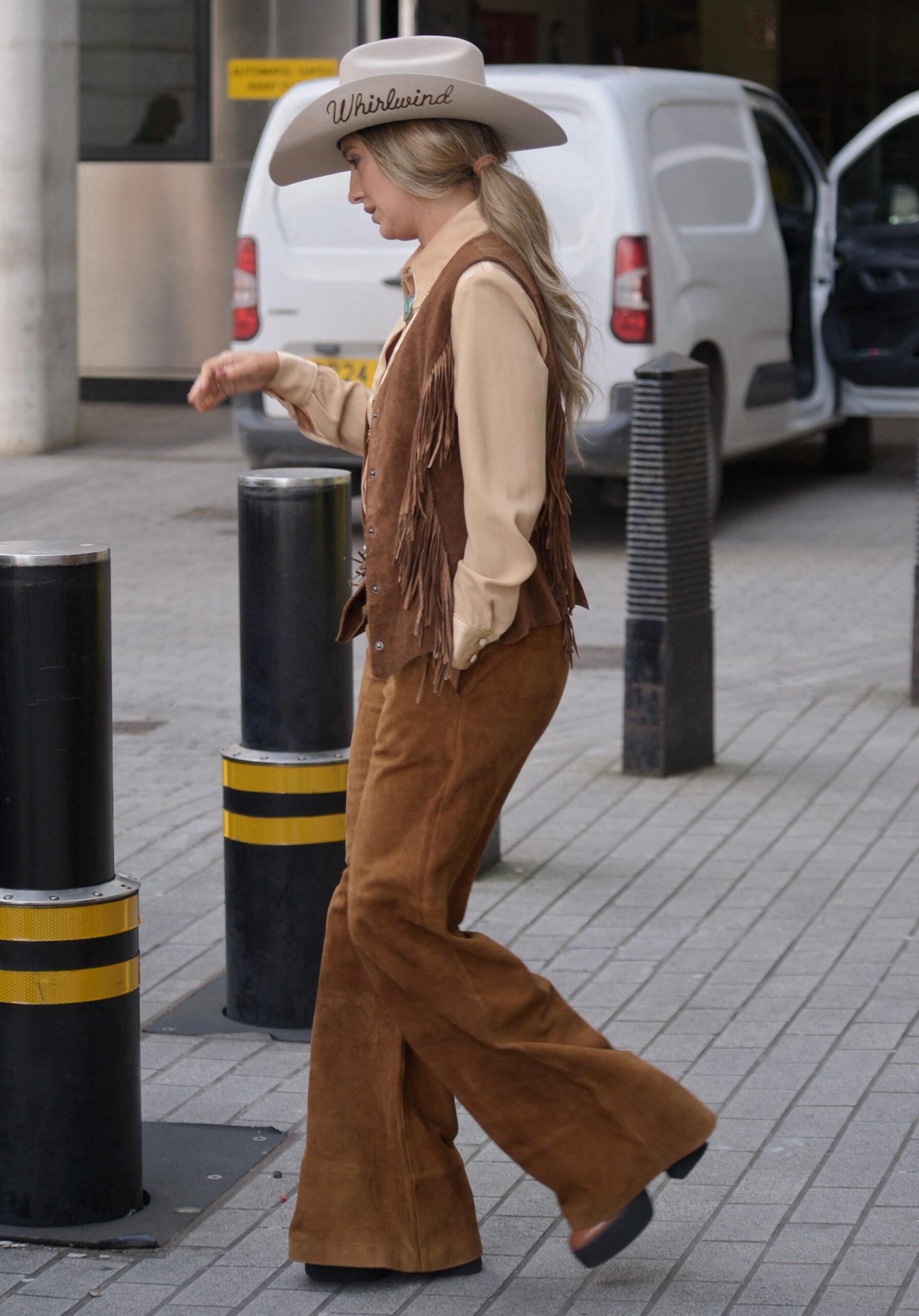 Lainey Wilson American country singer-songwriter blowing a kiss to photographers today at BBC Radio while promoting her new album Whirlwind on March 14, 2025 in London, England