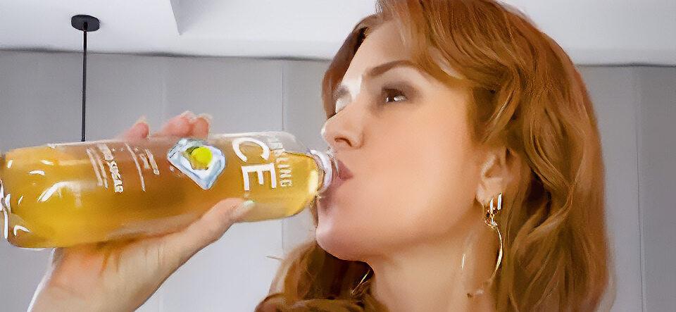 Isla Fisher sipping Sparkling Ice