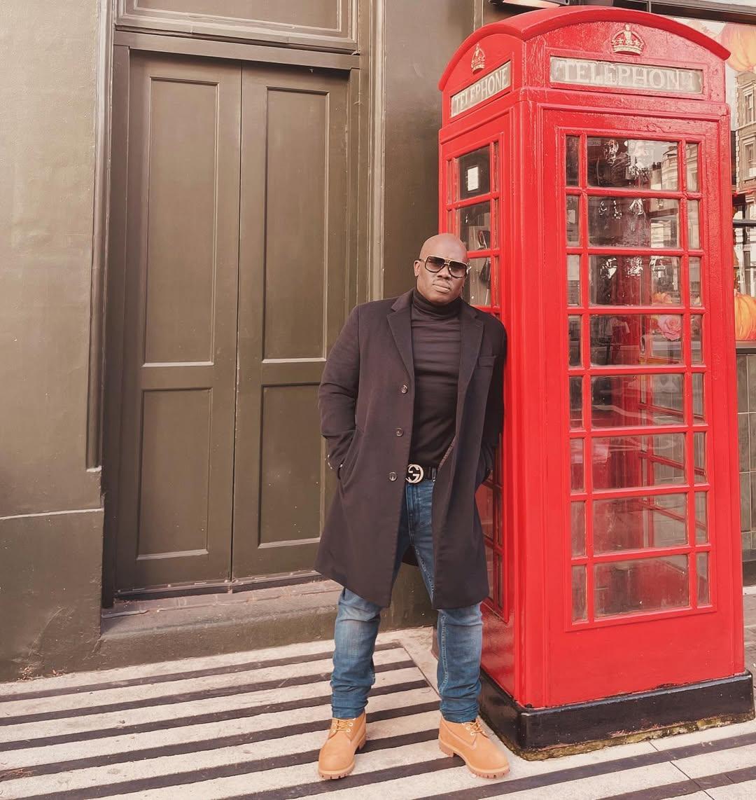 Mack Morrison next to a telephone booth