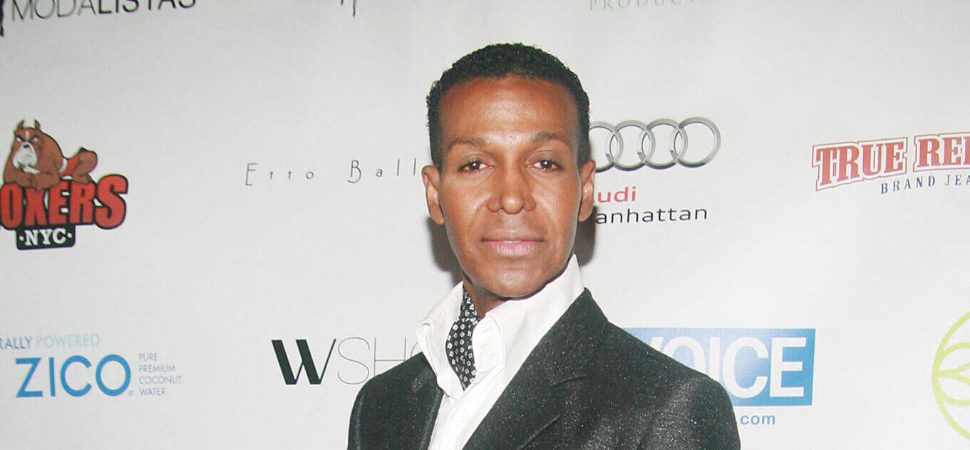 "RHOA" star Dwight Eubanks posing on the red carpet during New York Fashion Week Spring/Summer 2013.