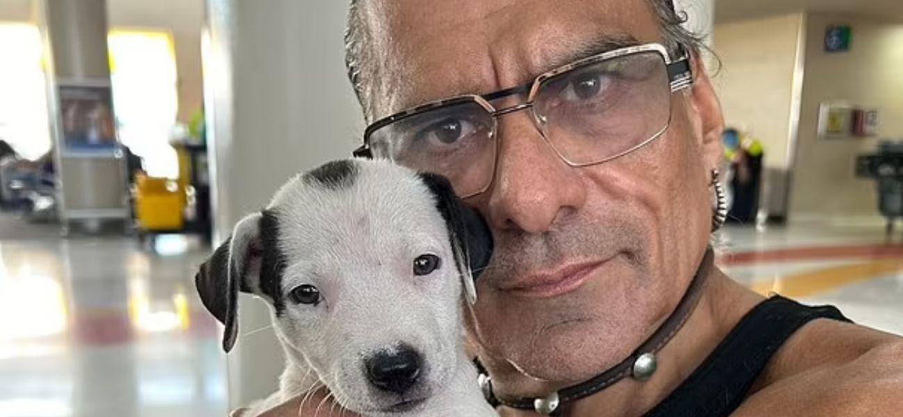 Jonathan Joss holding dog