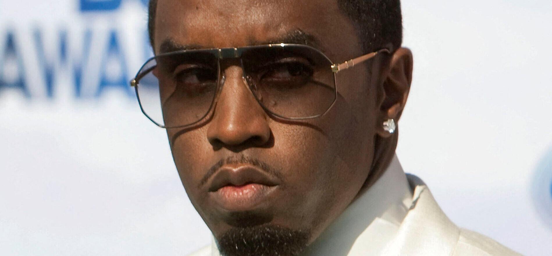 Diddy in white suit