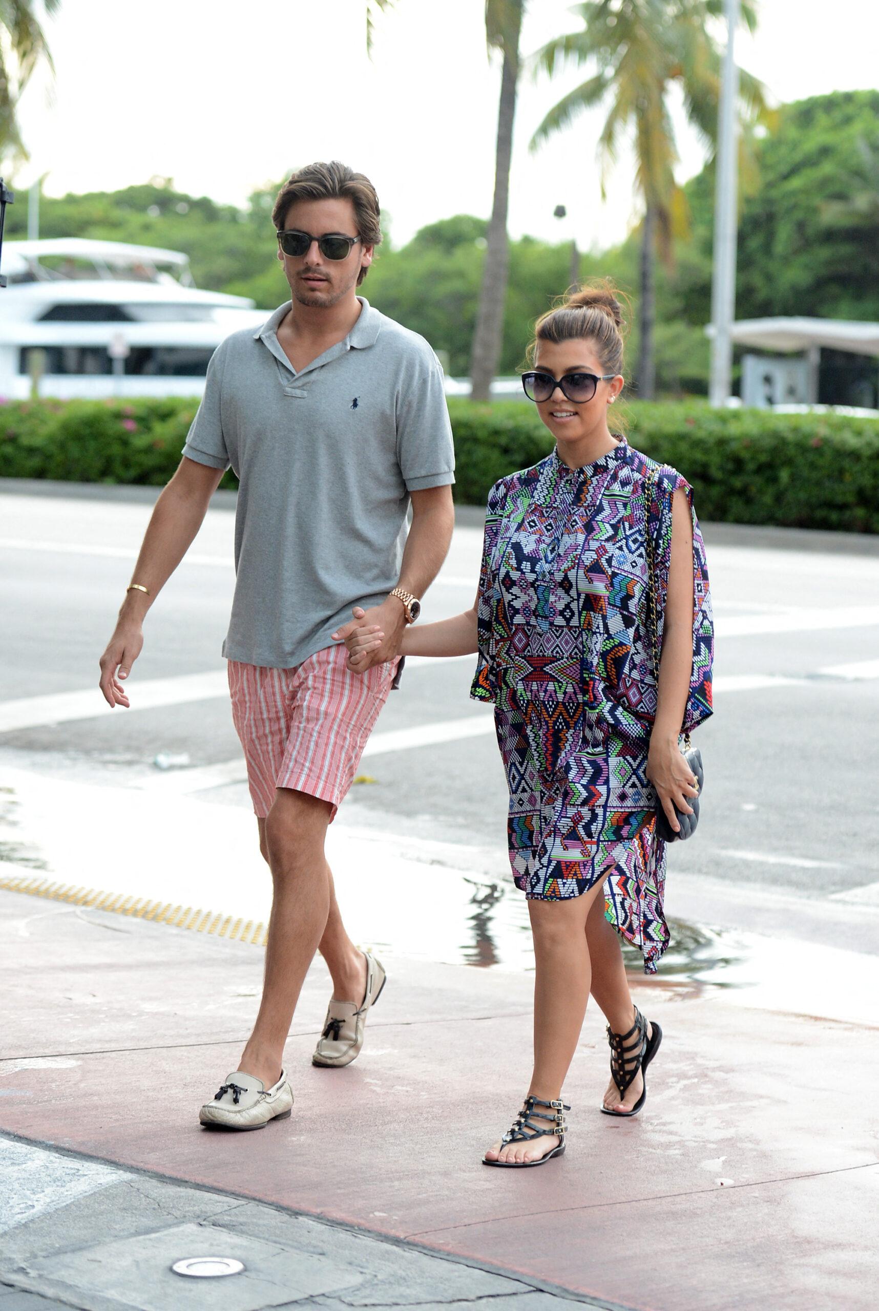 Kourtney Kardashian TV and his friend Scott Disick ride a red boat in Miami Beach