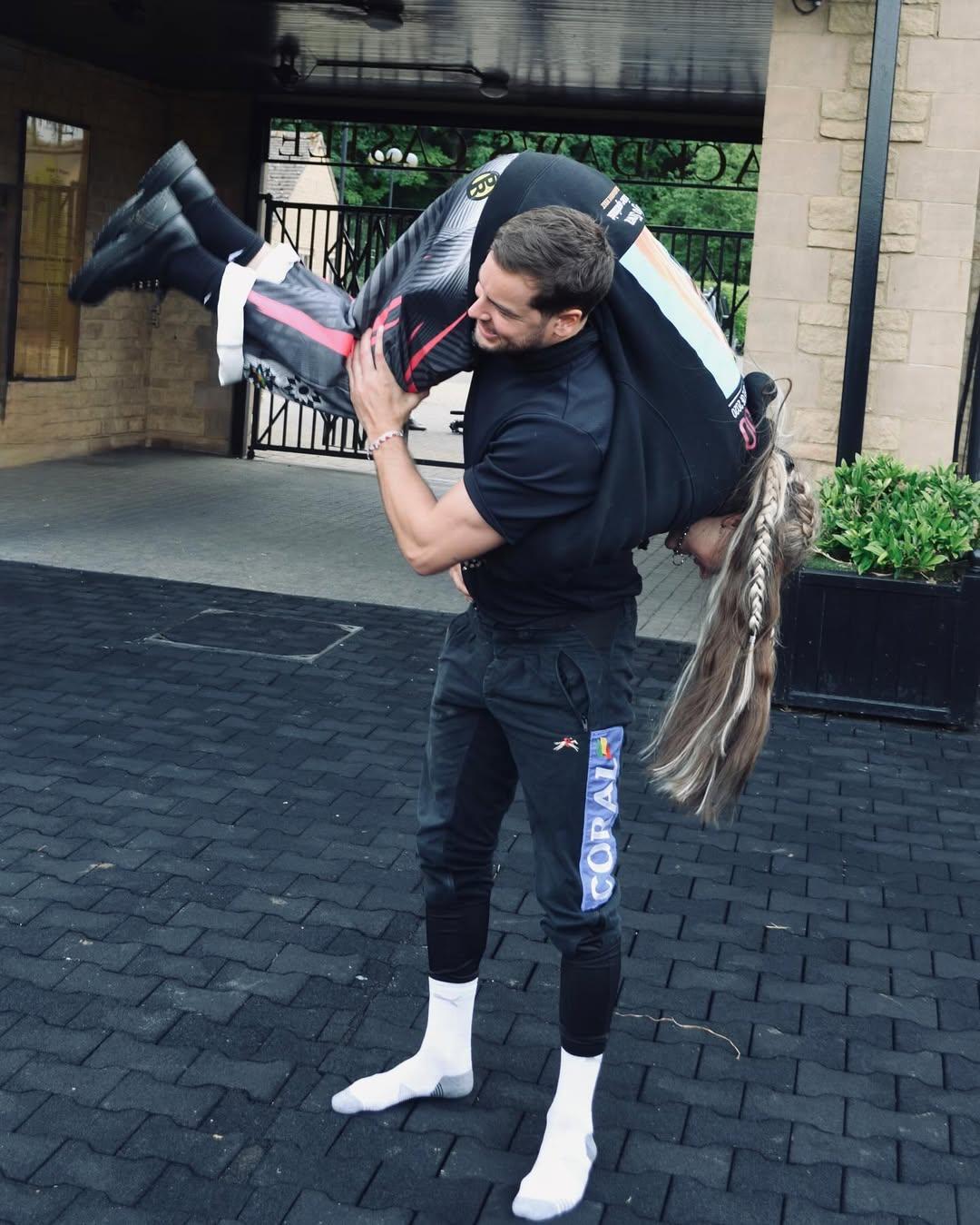 Chris Hughes holds Jojo Screas