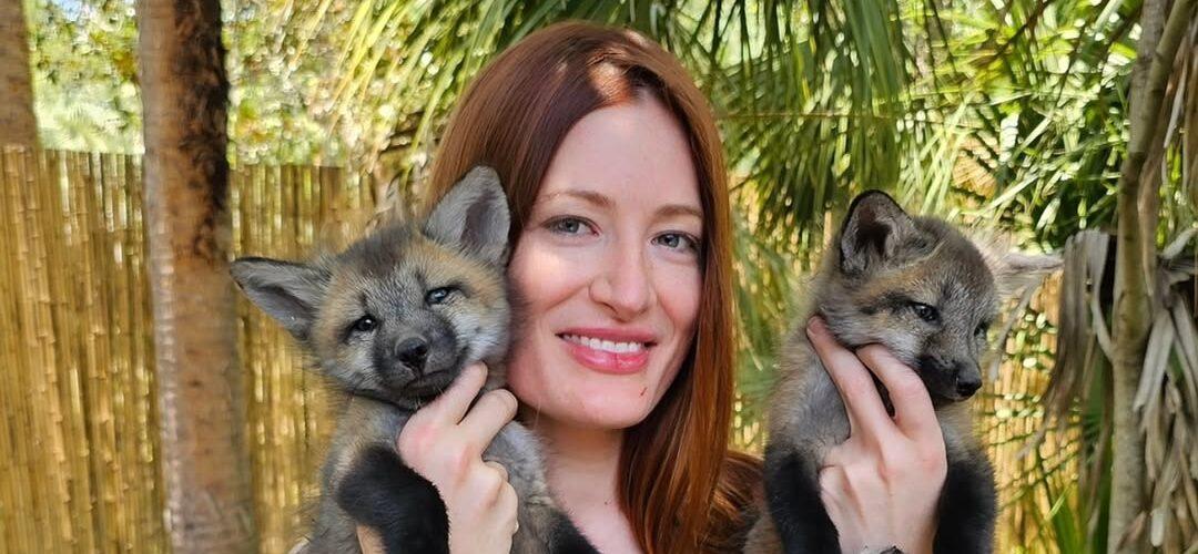 Mikayla Raines holding foxes