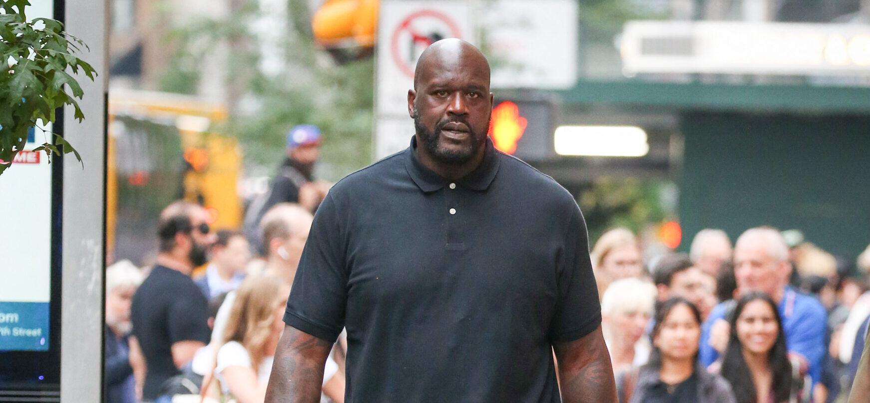 Shaq walking outside.