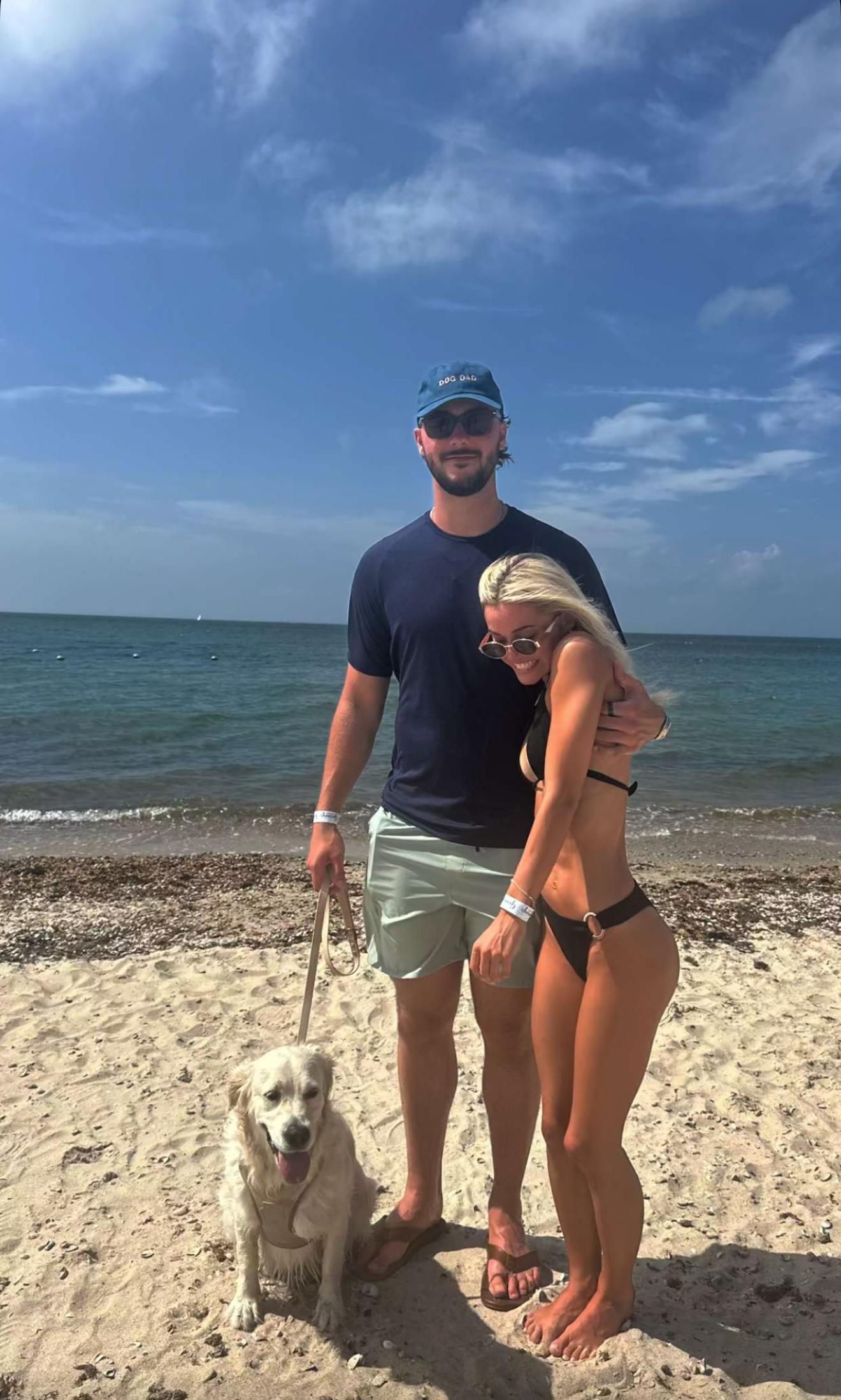 Olivia Dunne strikes a pose for the camera with her boyfriend Paul Skenes and their dog Roux. 