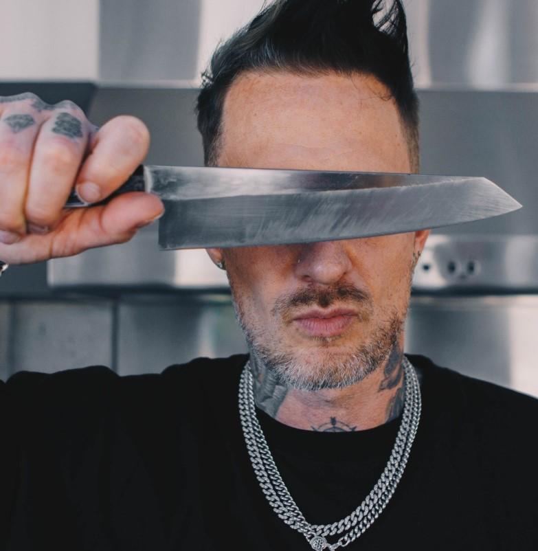 Michael Voltaggio holding a knife