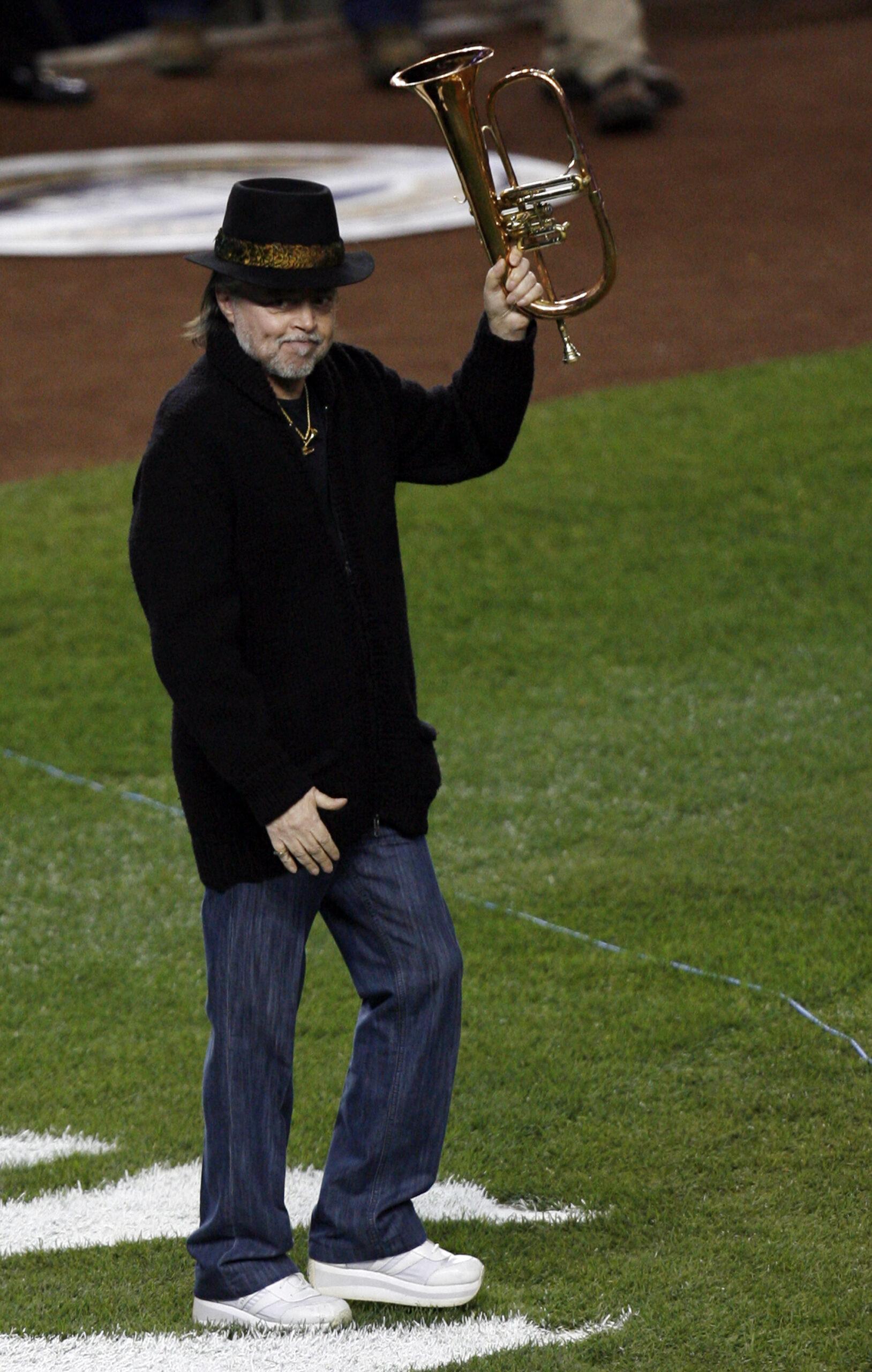 Recording artist Chuck Mangione performs the National Anthem before the Los Angeles Angels of Anaheim play the New York Yankees in game 6 of the ALCS at Yankee Stadium in New York
