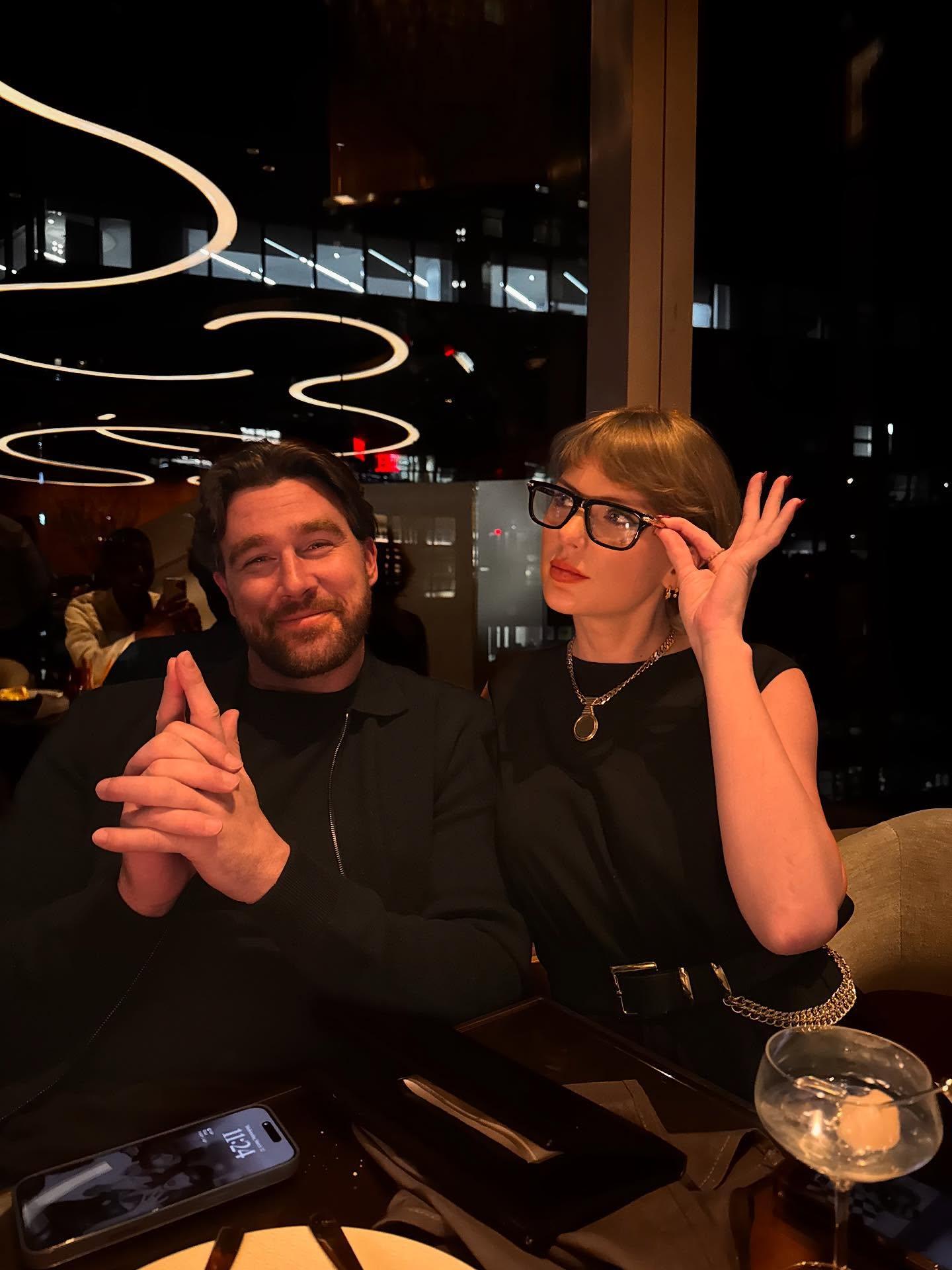 Travis Kelce poses with Taylor Swift