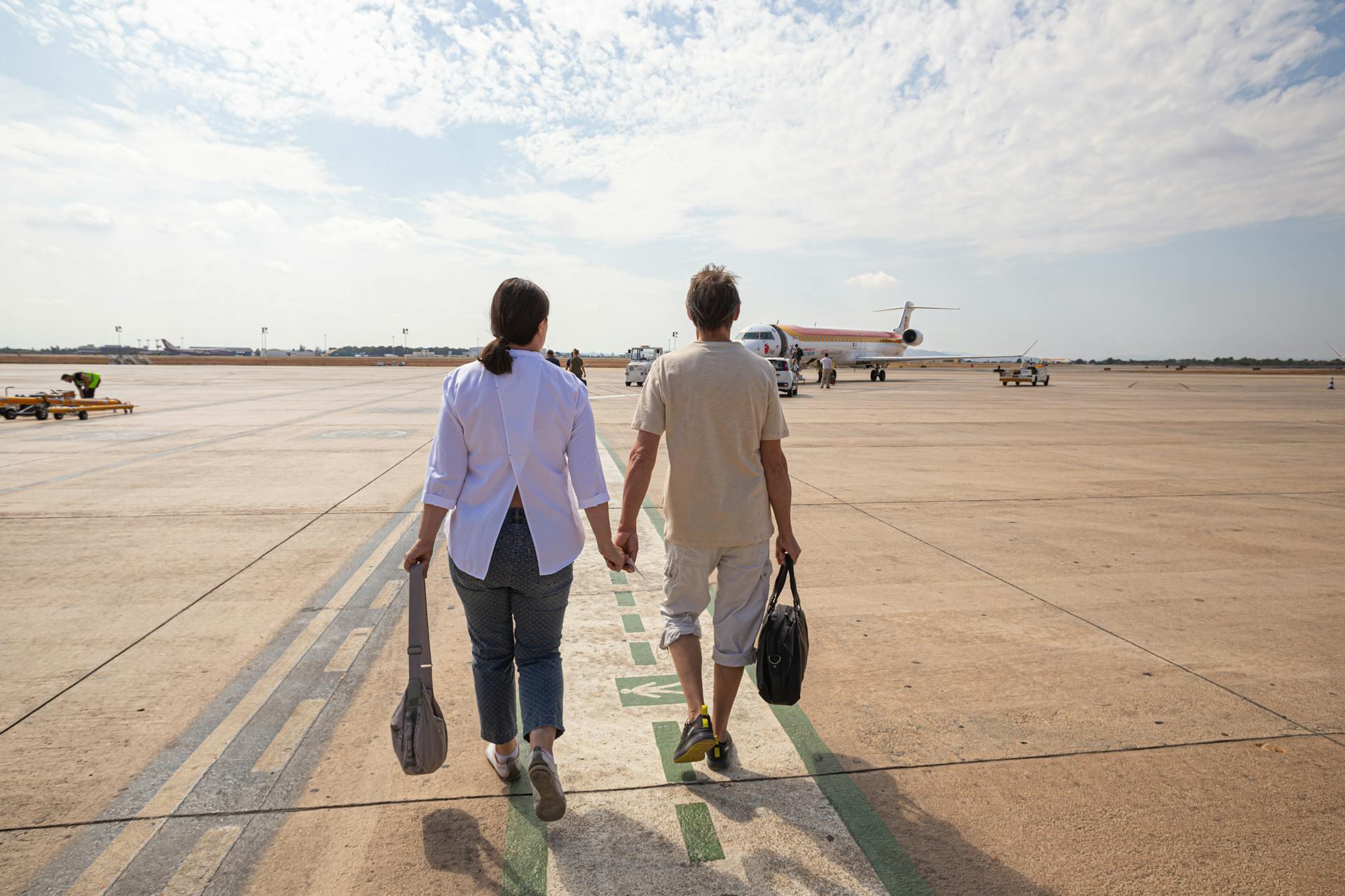 Couple going to board a plane at the airport