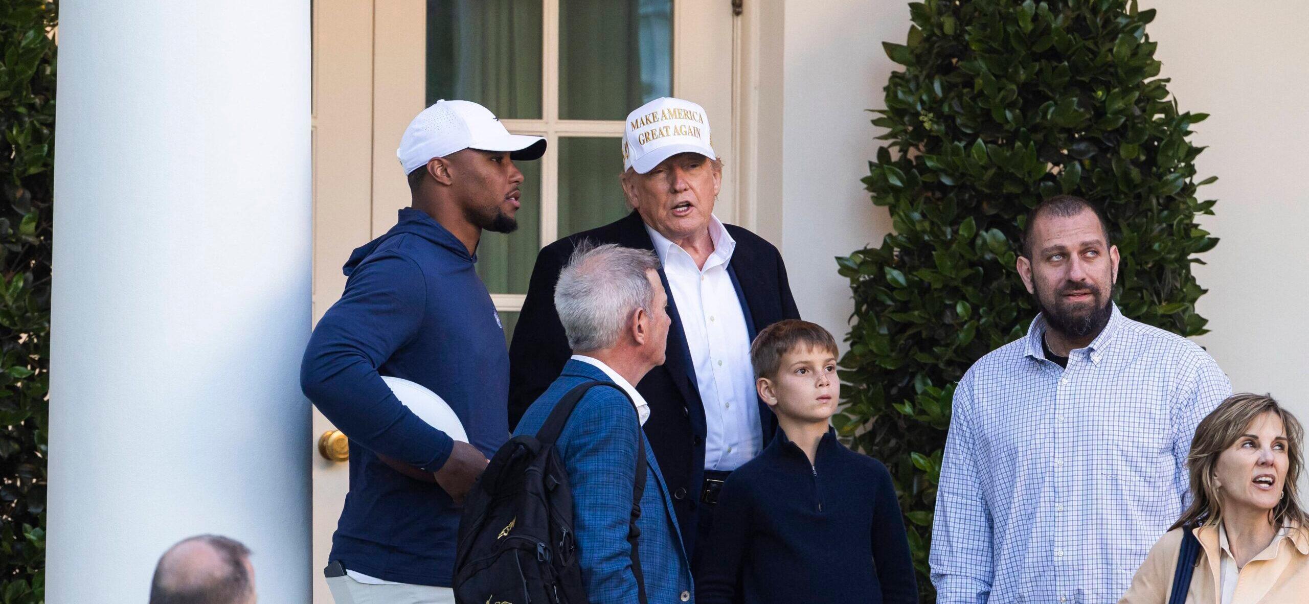 Saquon Barkley posing with Donald Trump.
