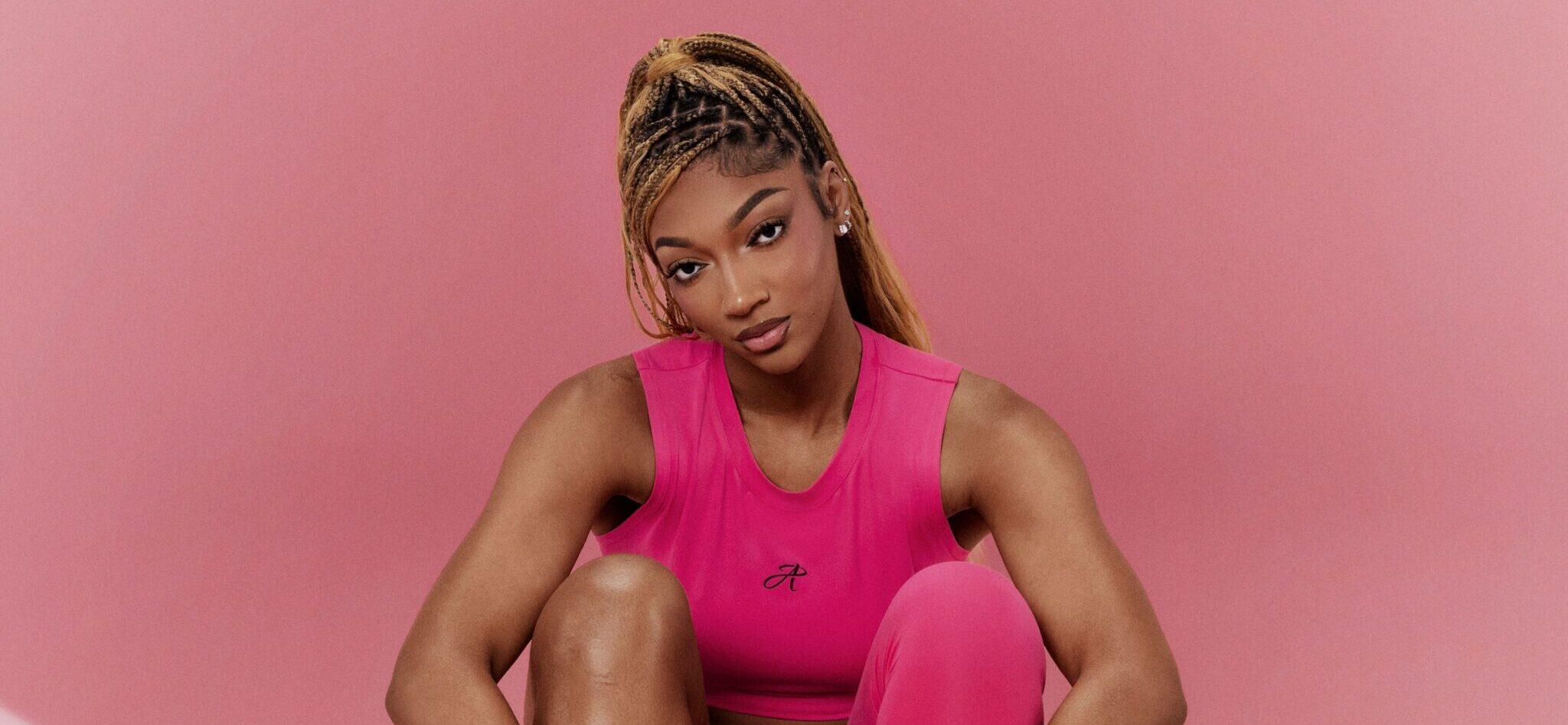 Angel Reese posing in her signature shoe.