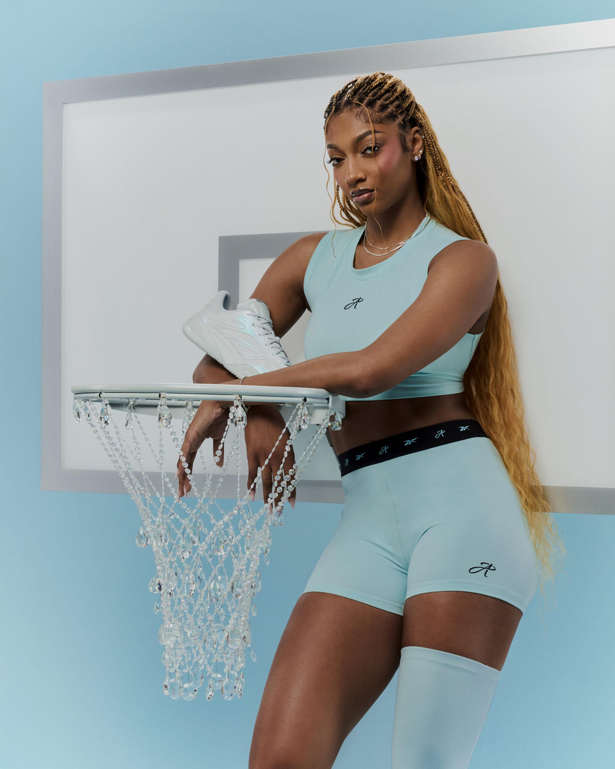 Angel Reese posing with her signature shoe. 