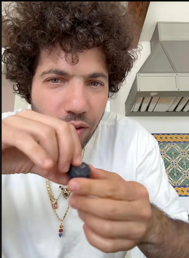 Benniko eats wild grapes