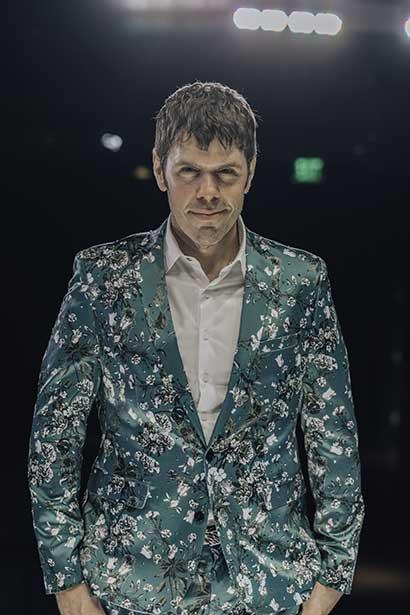 Perez Hilton in a green suit