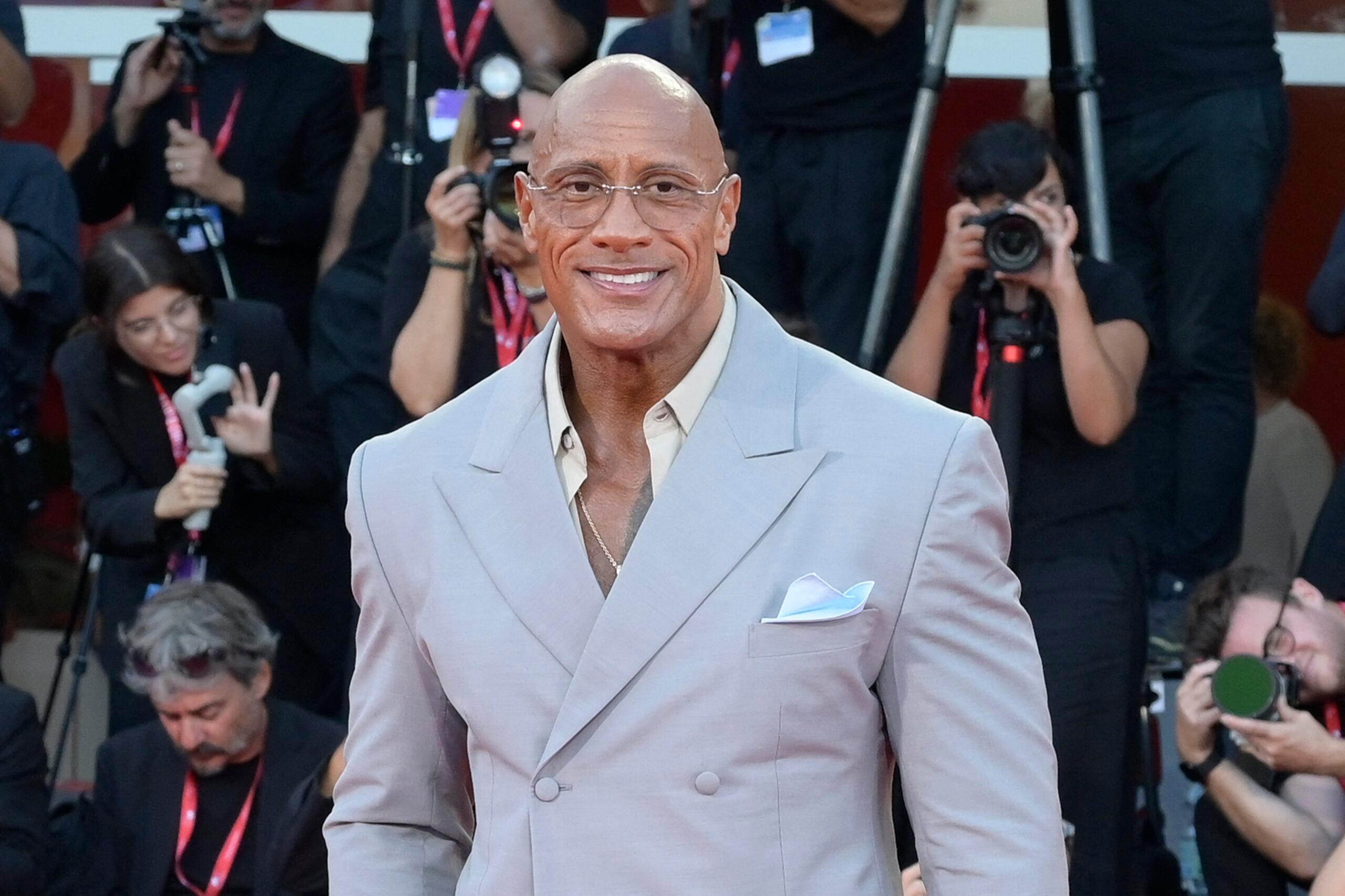 Dwayne Johnson in the red carpet is a destruction machine in Italy