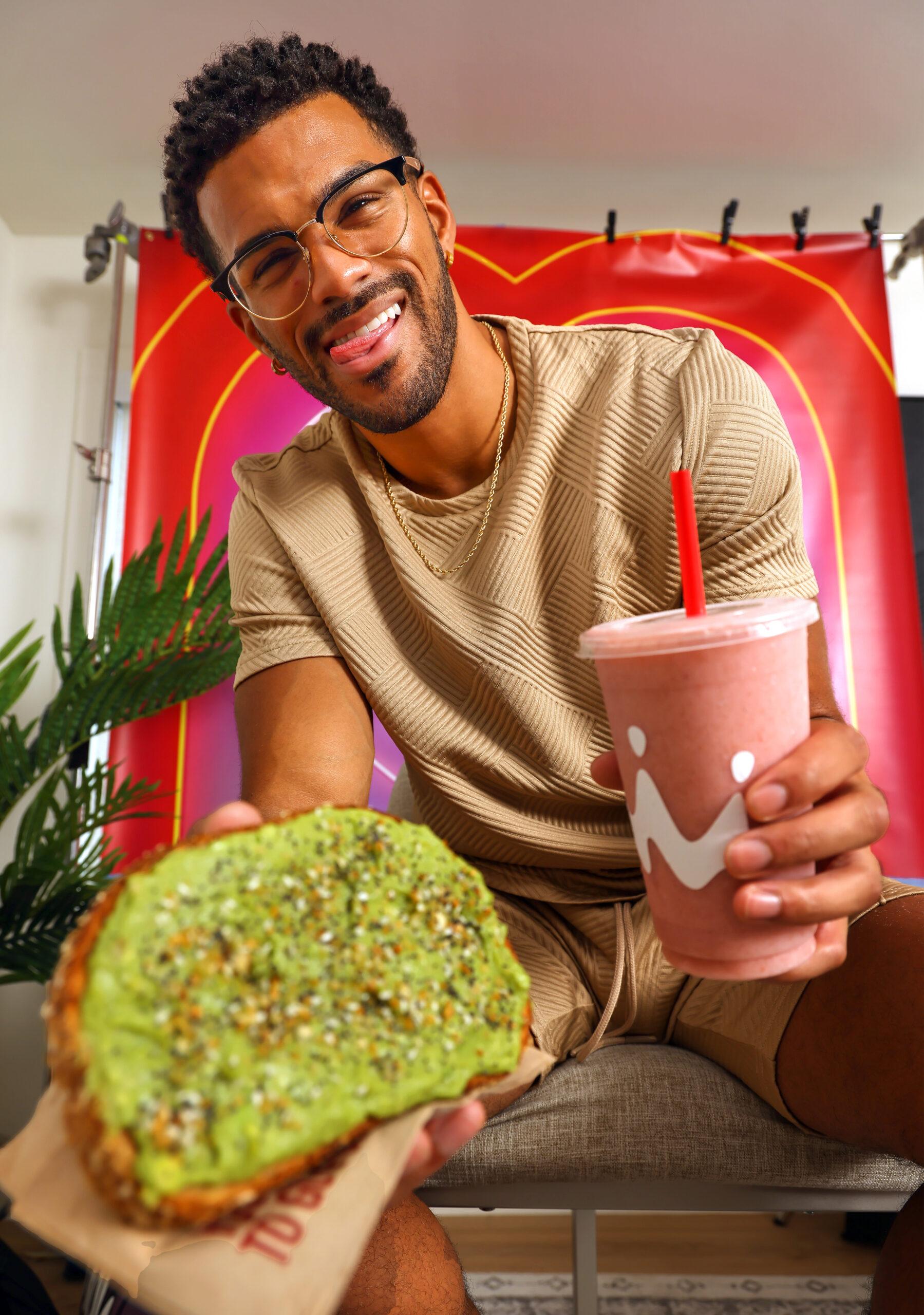 Jeremiah Brown with smoothie and avocado toast