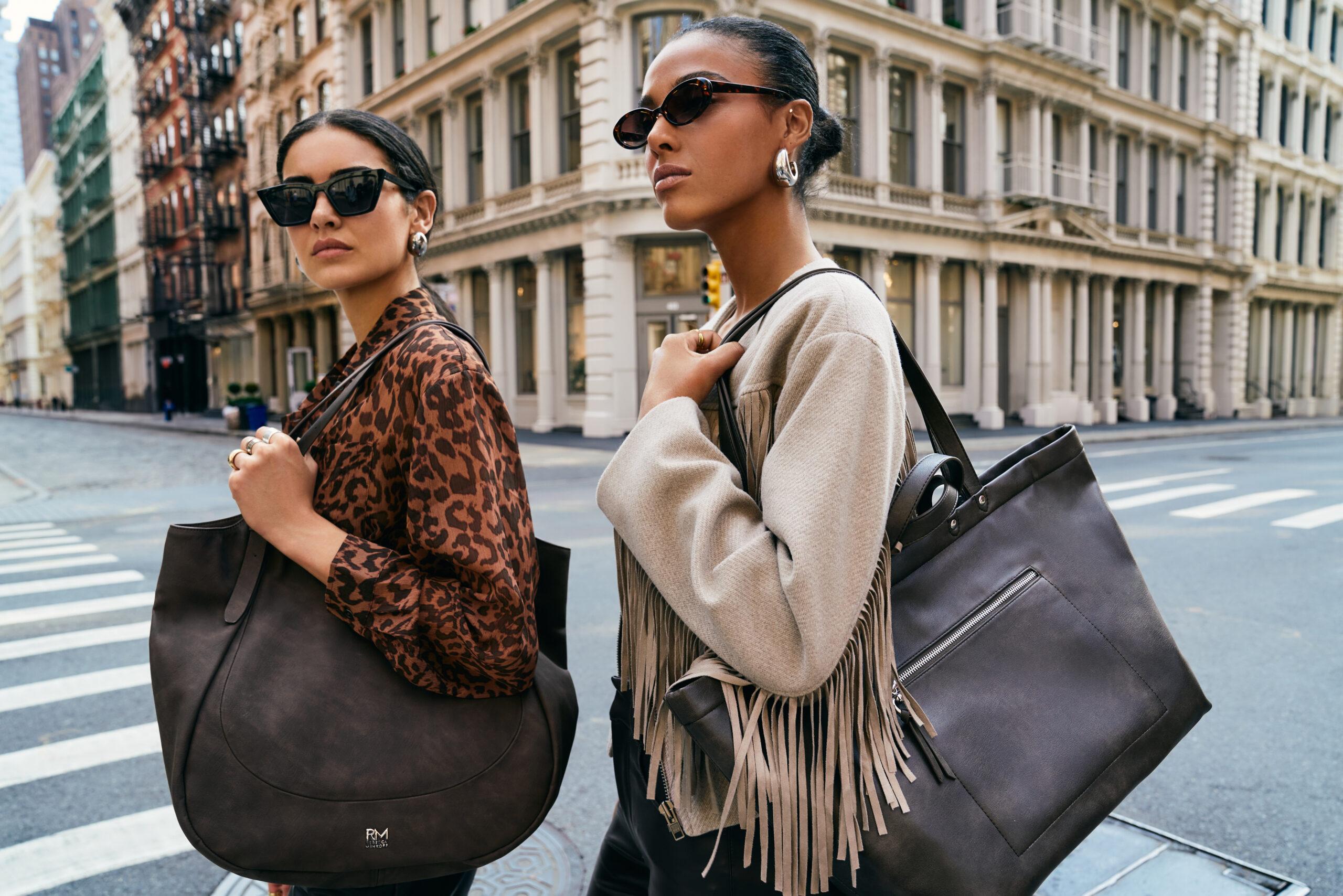 Two women walking holding RM Rebecca Minkoff bag