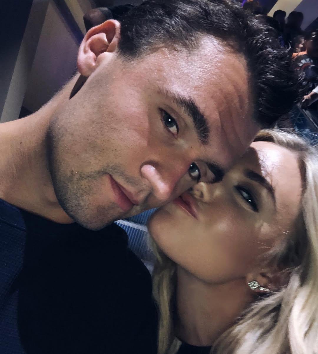Erika Kirk kissing Charlie Kirk's cheek