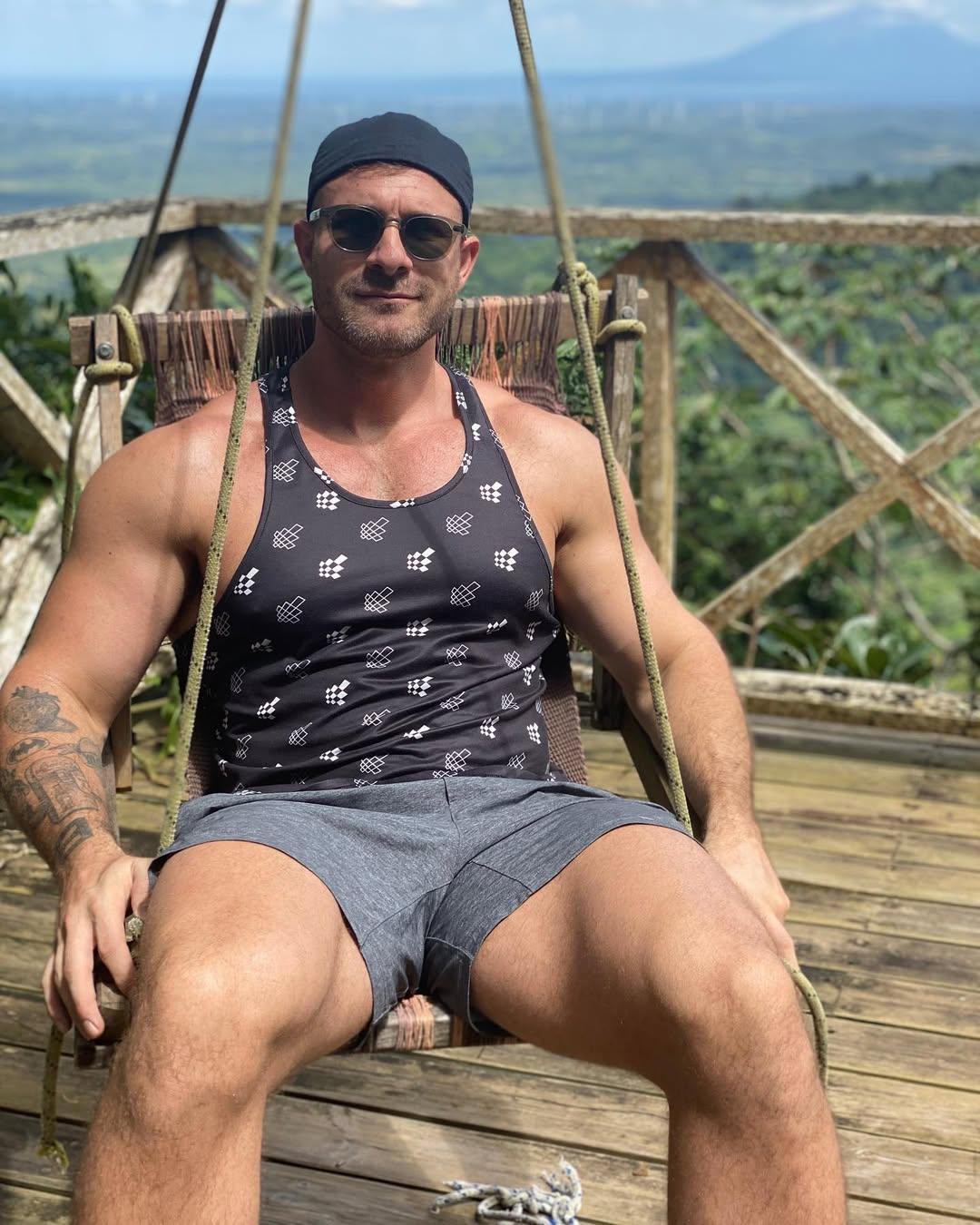 Austin Wolf posing on a chair. 