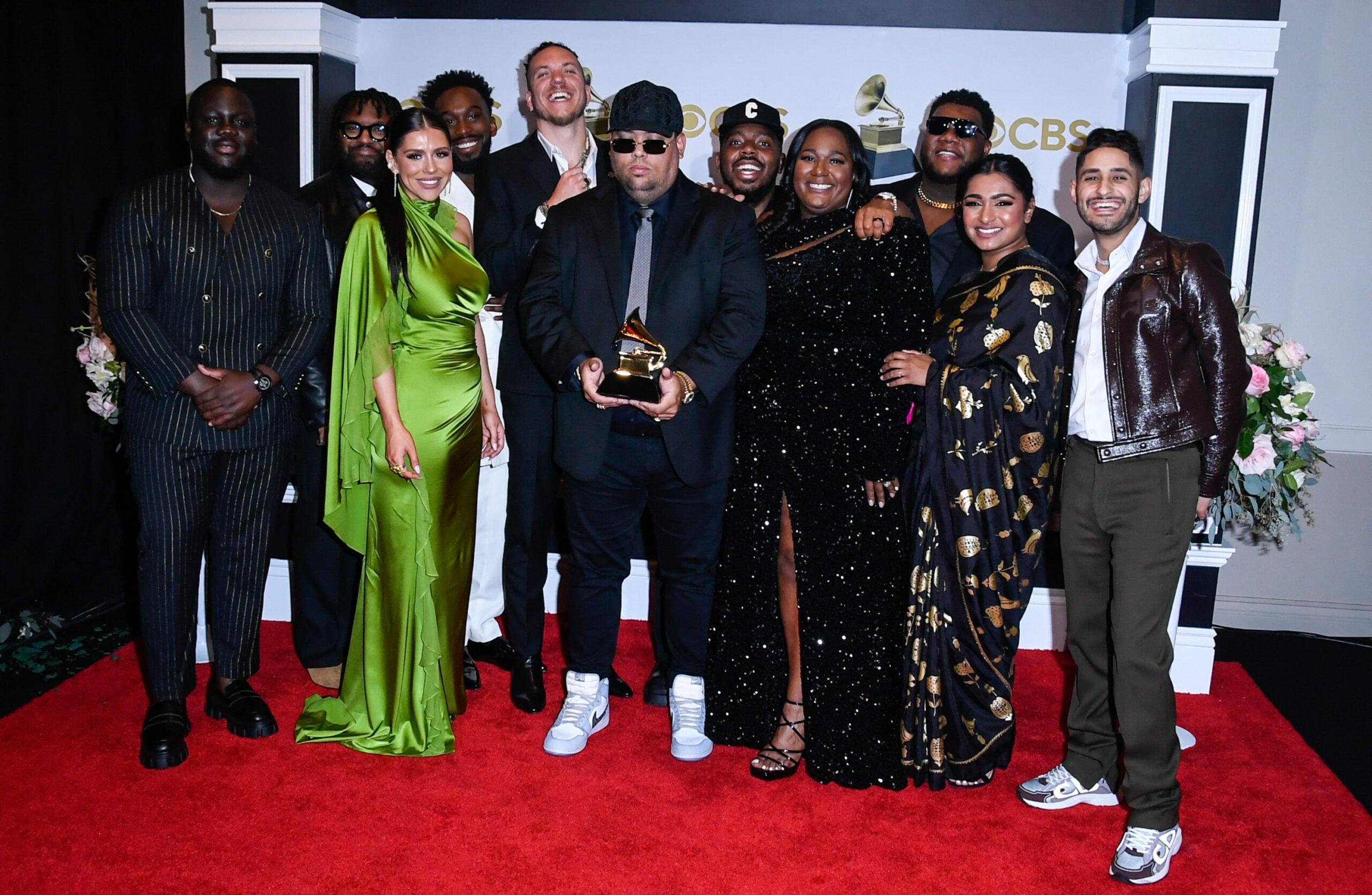 Maverick City Music posing on the red carpet. 