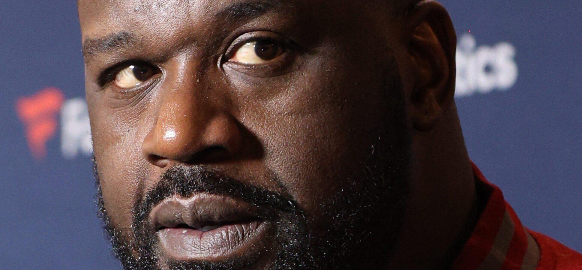 Shaq posing for a picture.