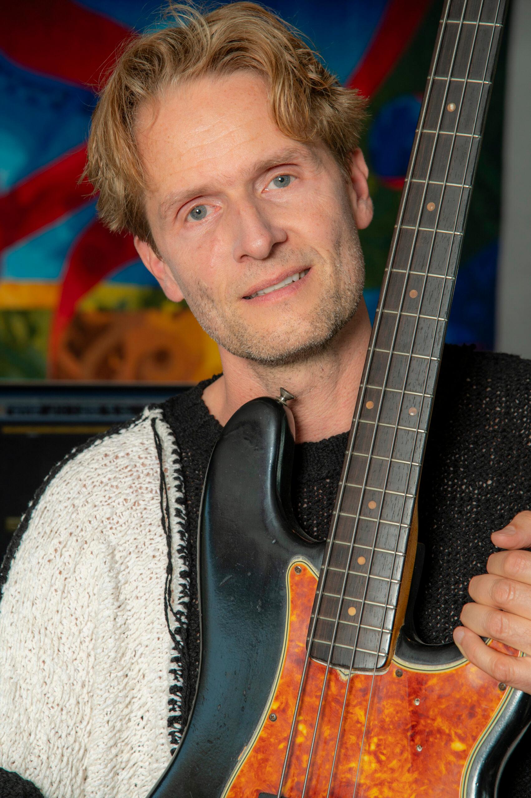 Toby Gad holding guitar
