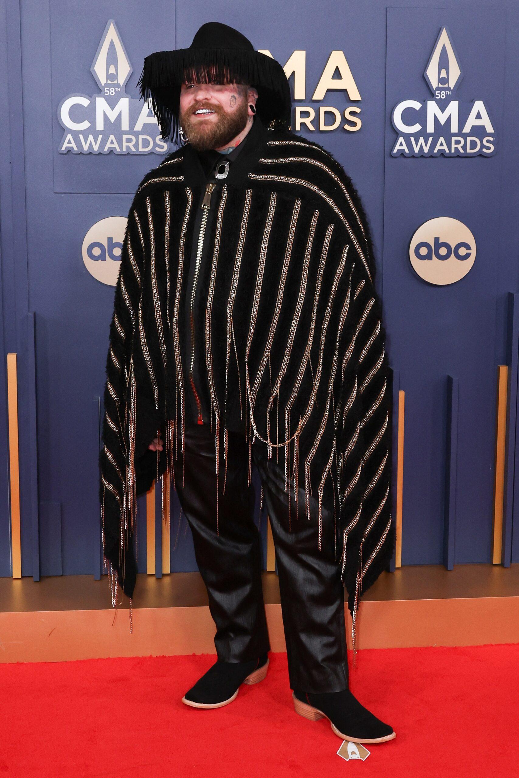 Teddy Swims posing on the red carpet. 