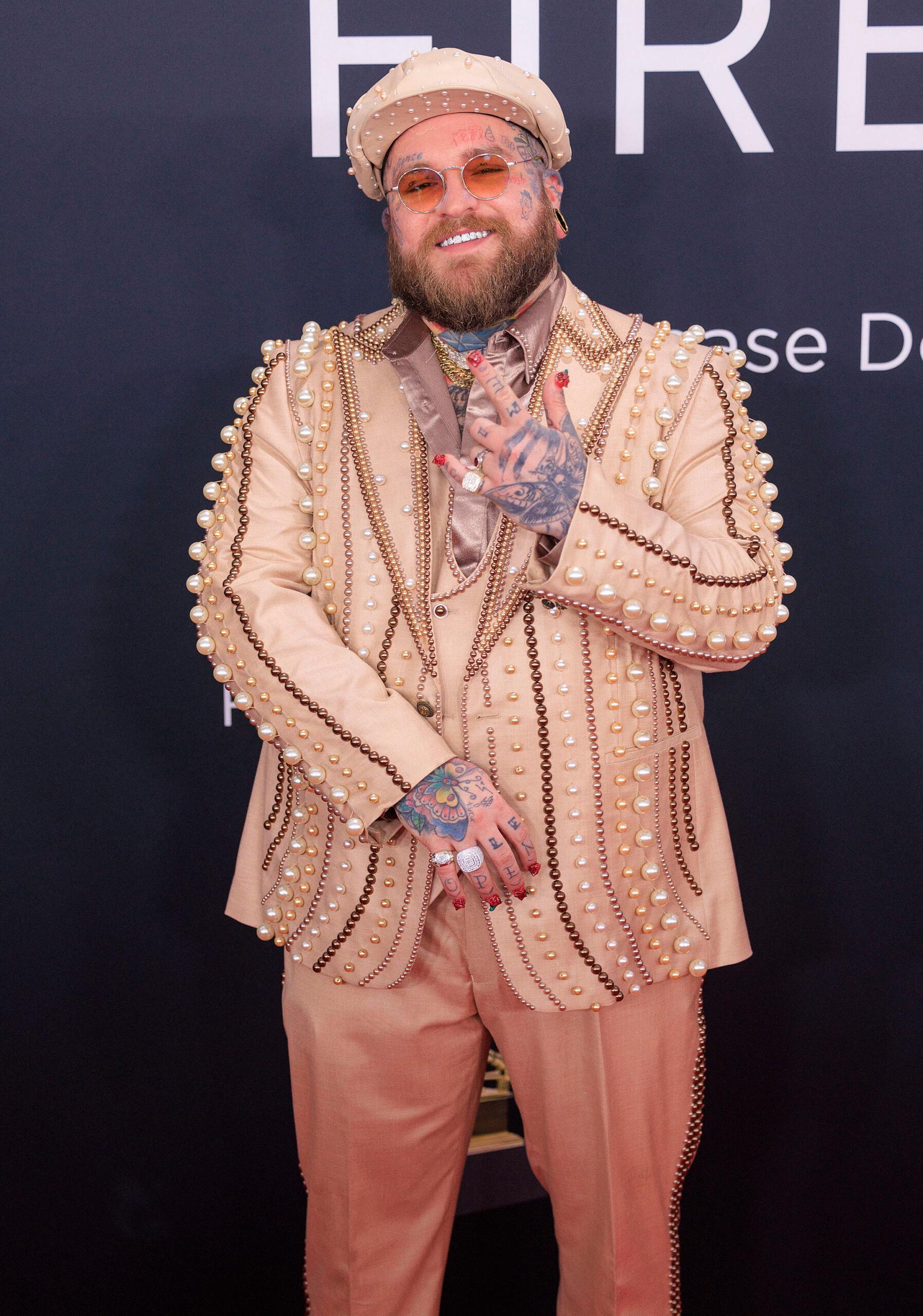 Teddy Swims posing on the red carpet. 