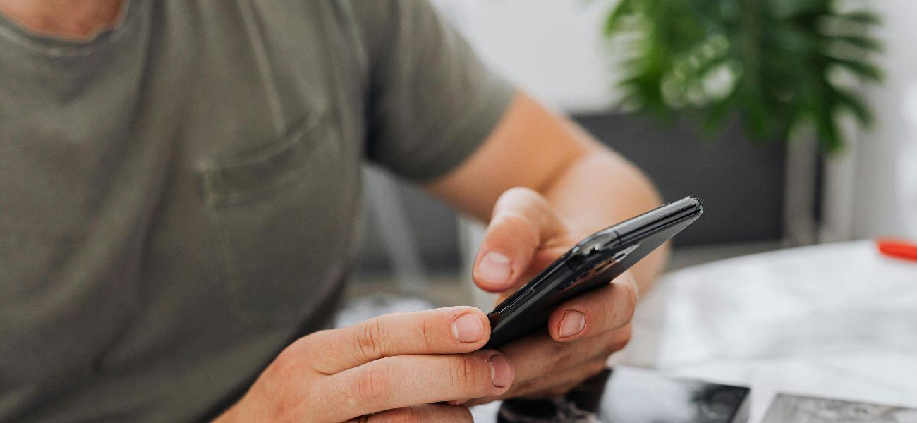 Man typing on phone