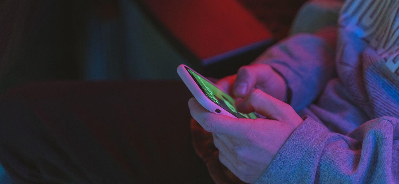 Person typing on their phone