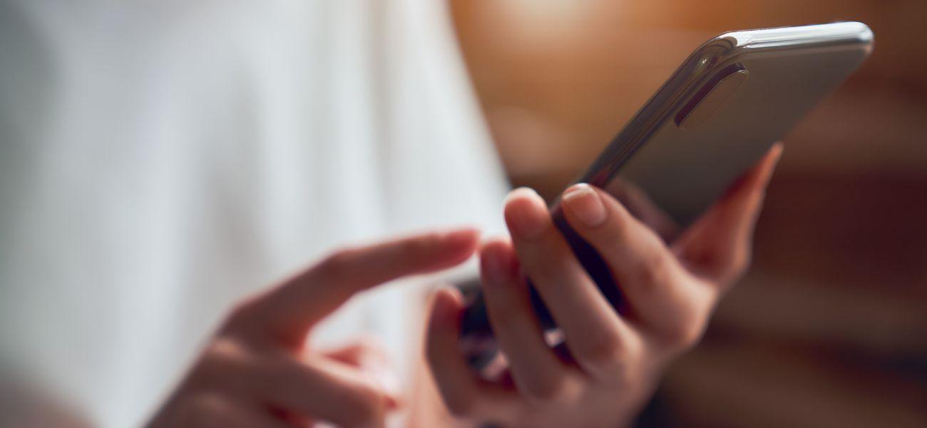 Person typing on their phone