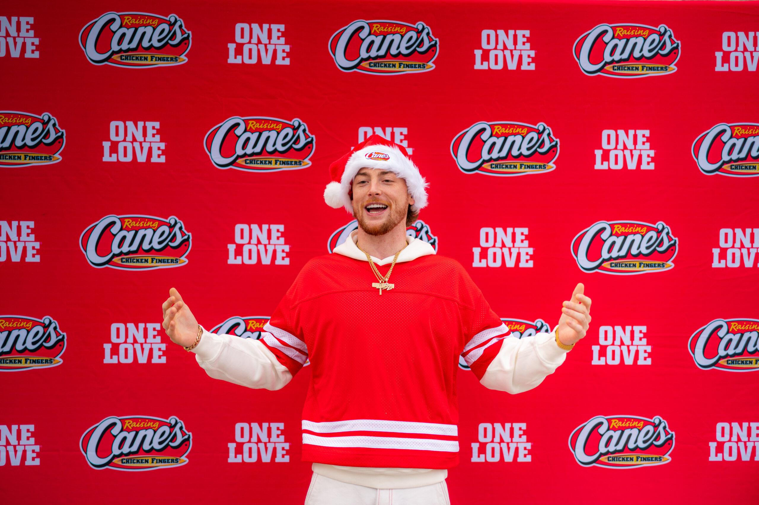 Bailey Zimmerman at Raising Cane's event for bike giveaway