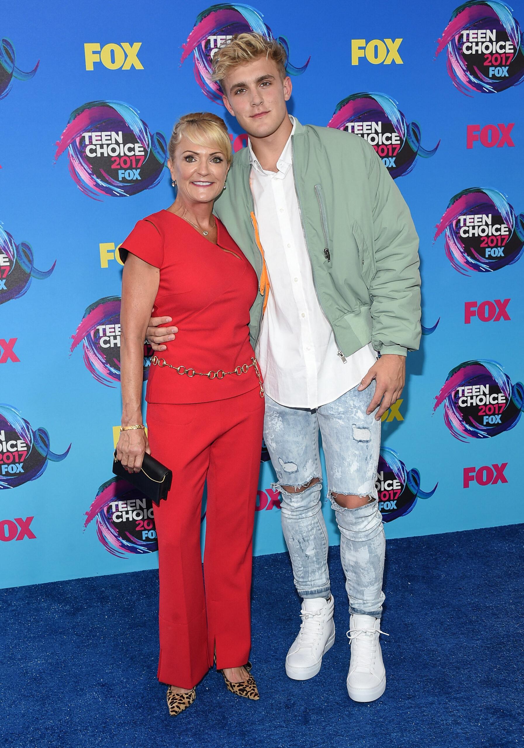 Jake Paul with mother on red carpet. 