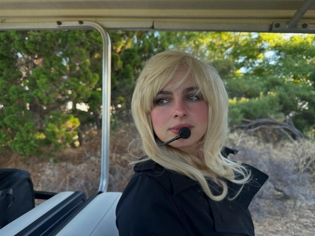 Addison Rae on a golf cart
