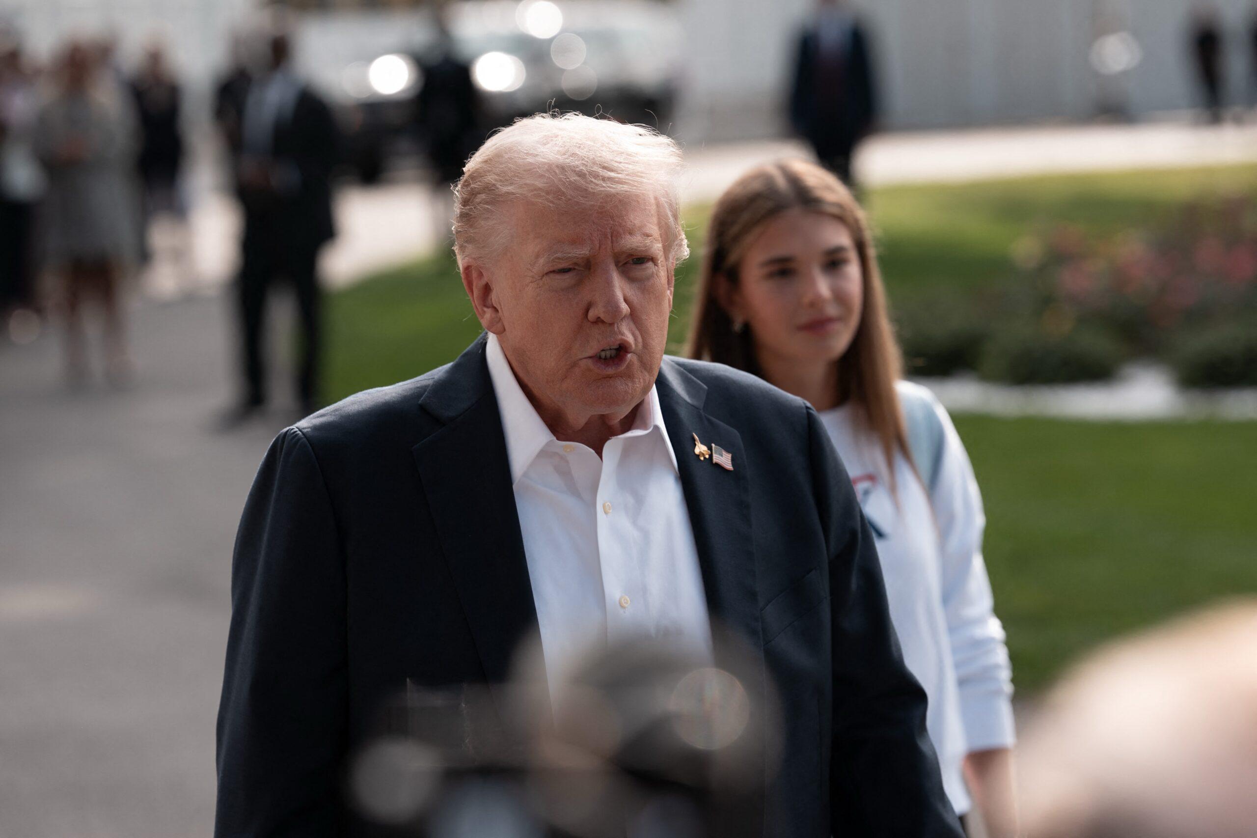 Donald Trump and his granddaughter Kai Trump 
