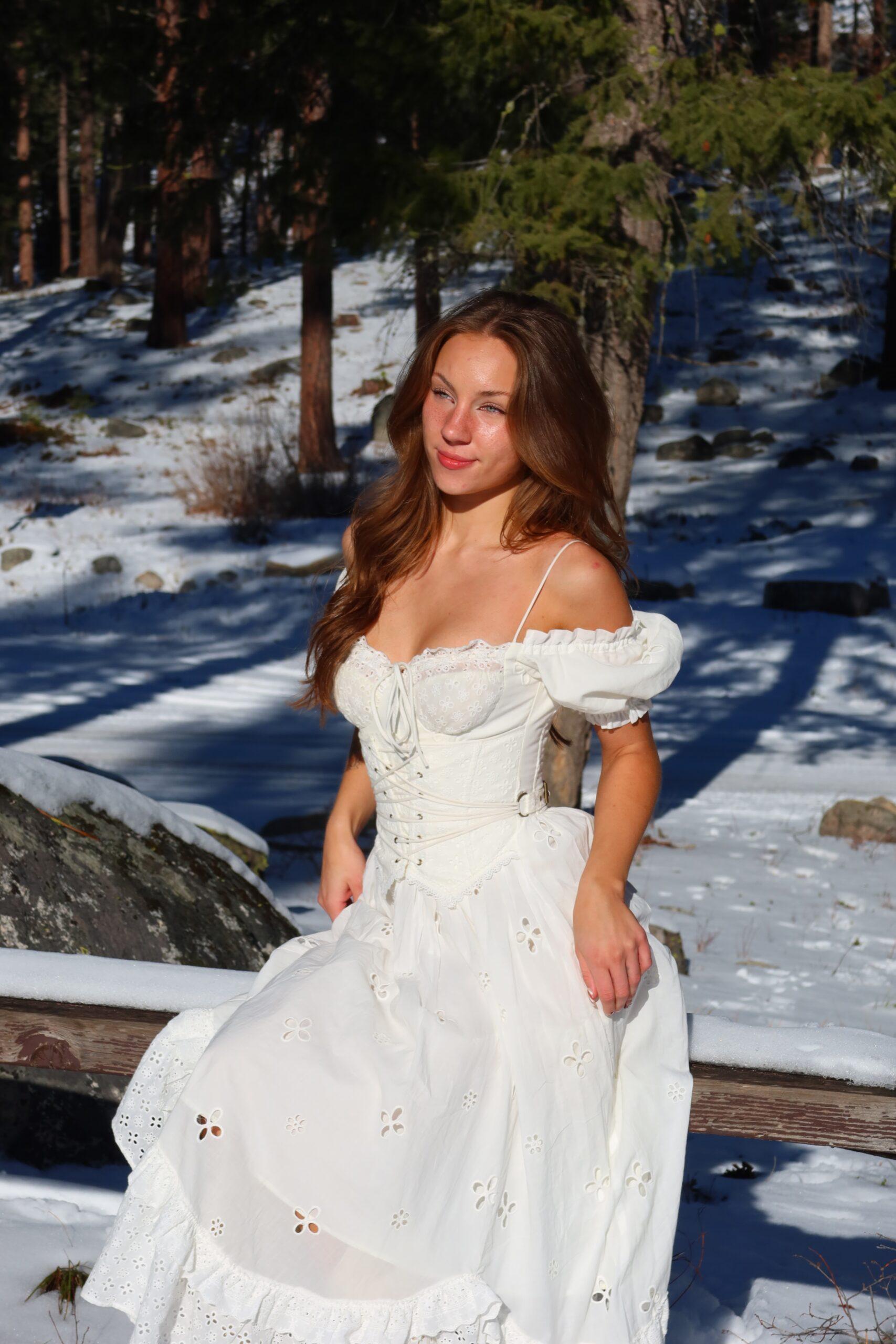 Anya Lacey wearing a long white dress