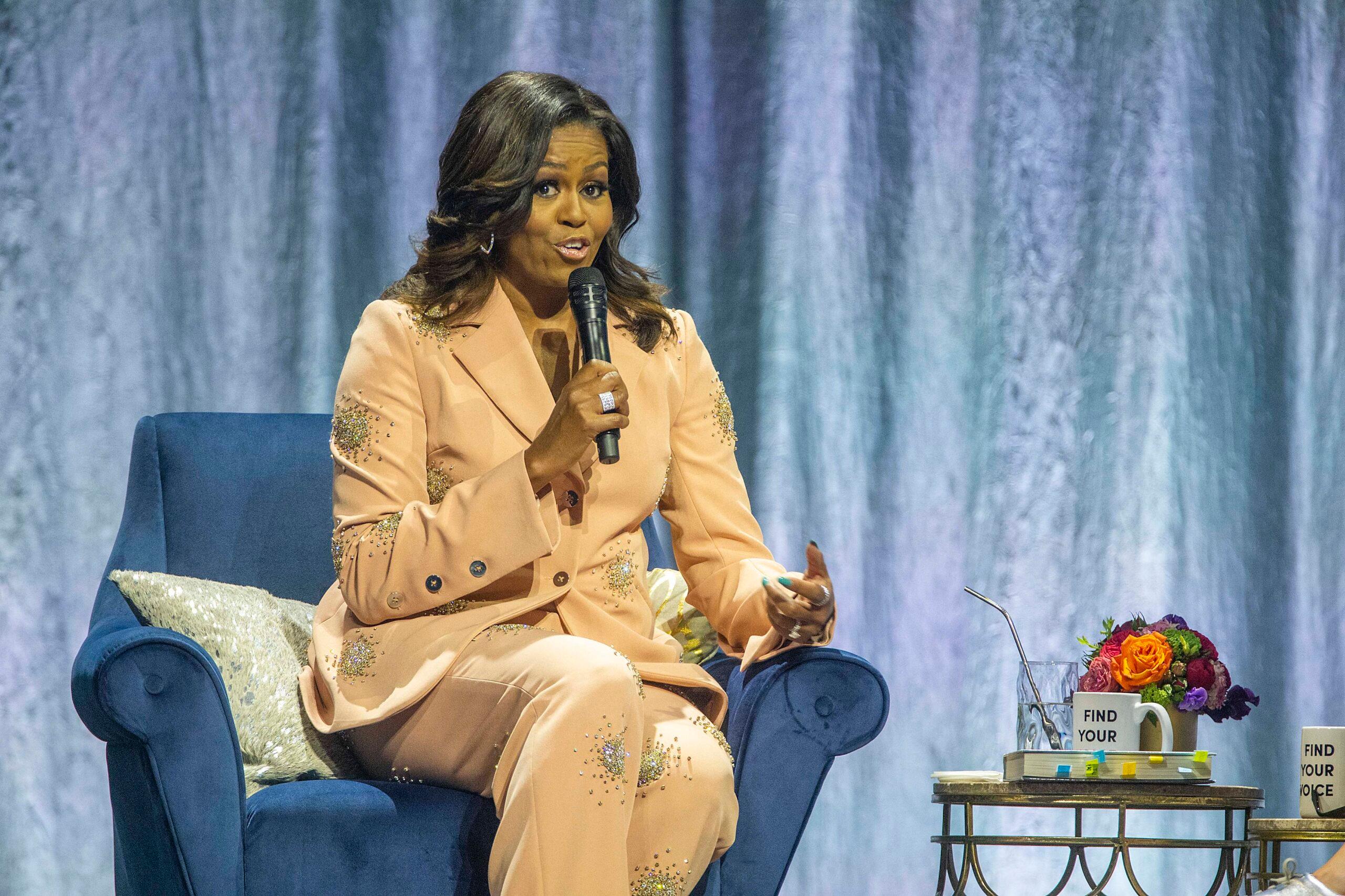 Michelle Obama speaking at an event. 