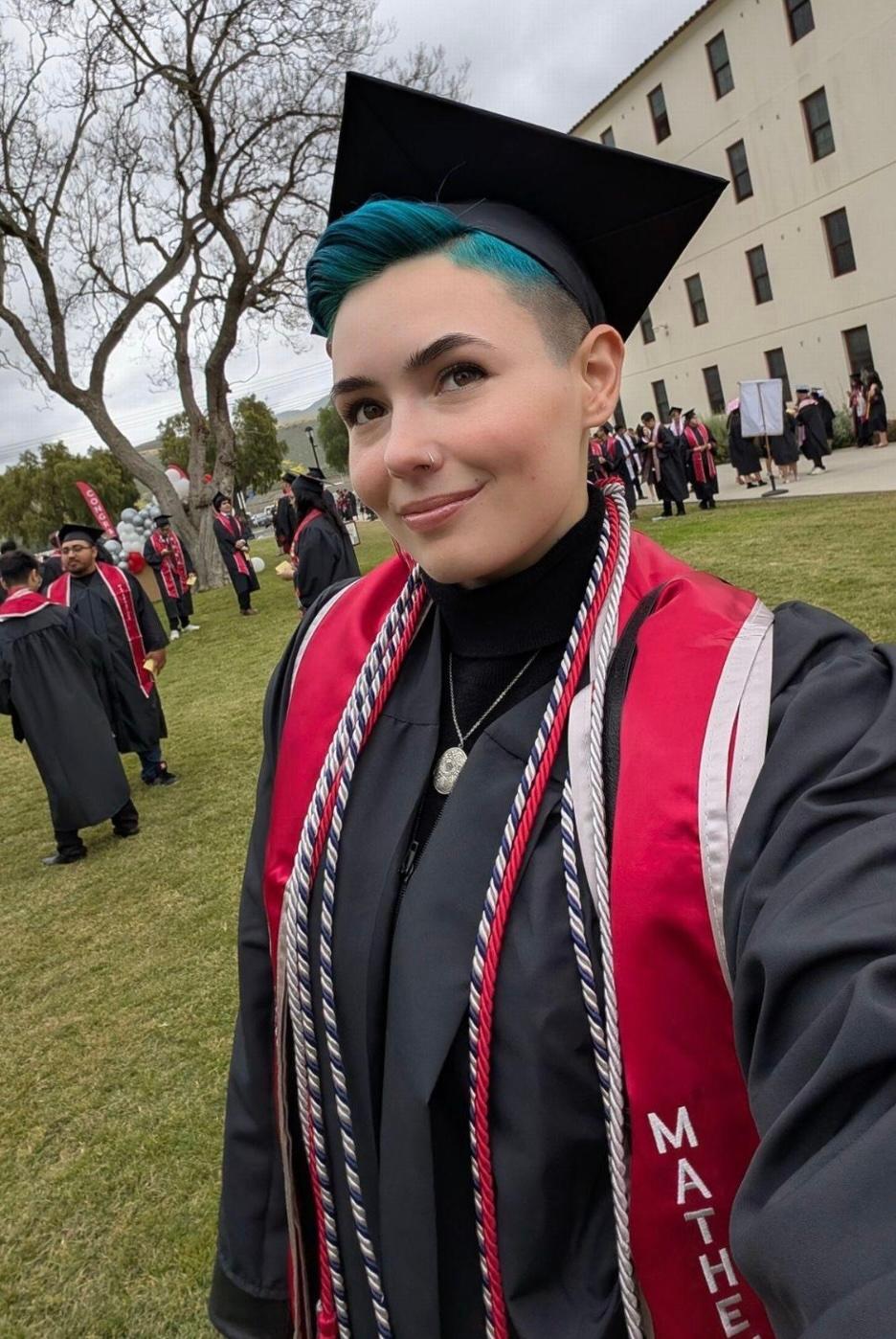 Kit Barrus wearing graduation hat and jacket