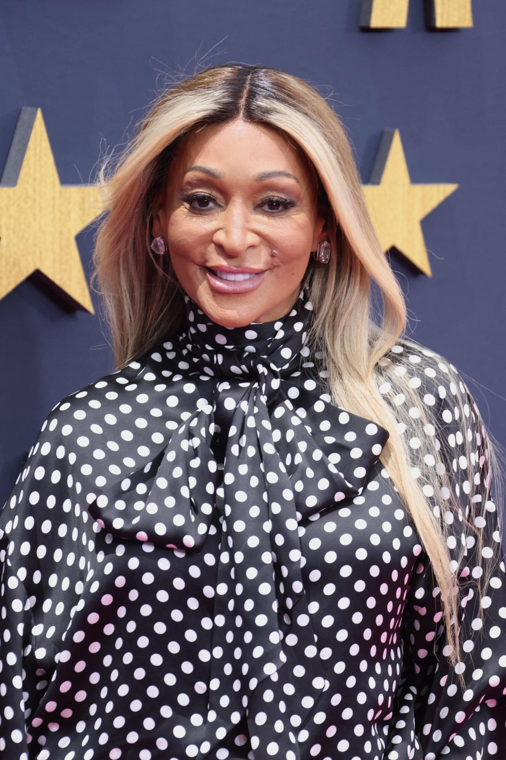 Wearing a black and white dress. 