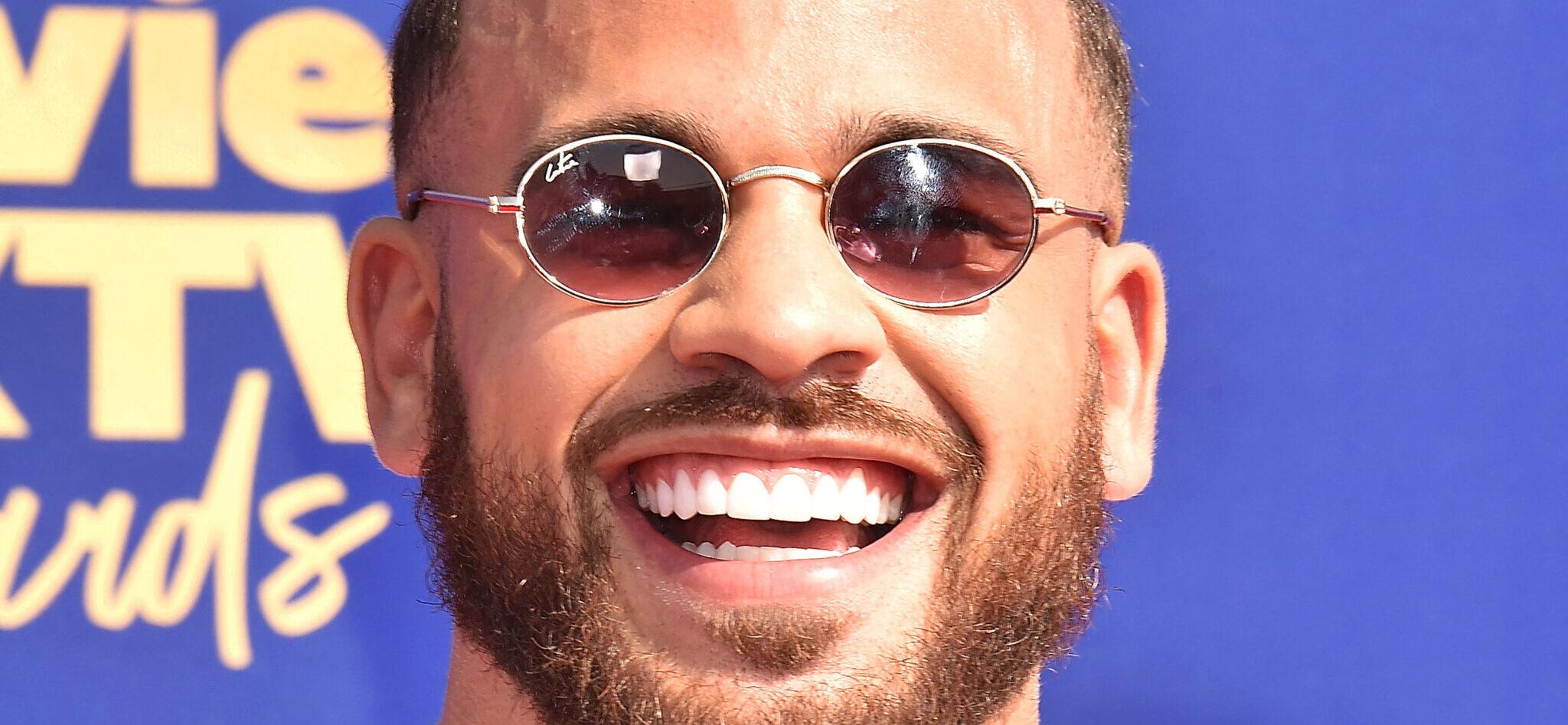 Cory Wharton posing on the red carpet.