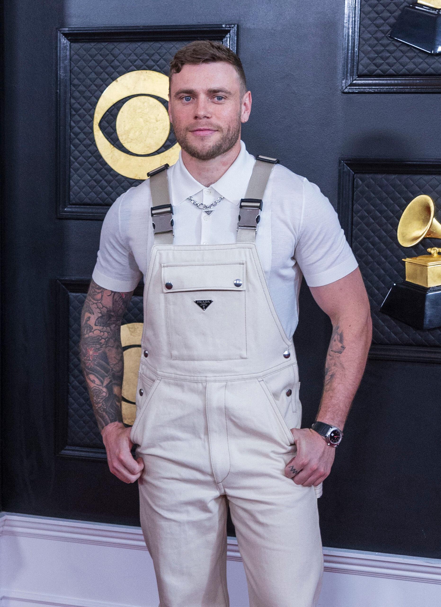 Gus Kenworthy posing on the red carpet. 