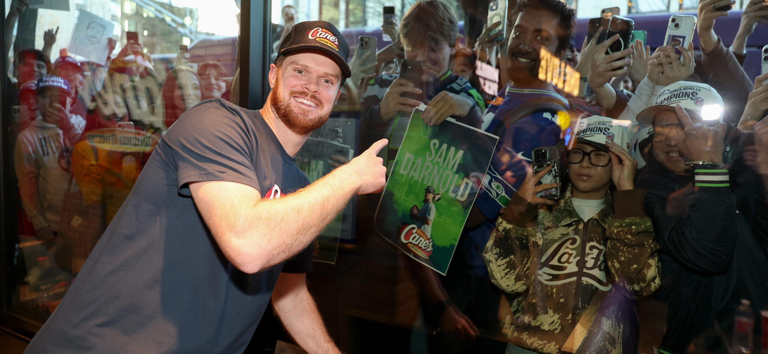 Sam Darnold with fans in Seattle