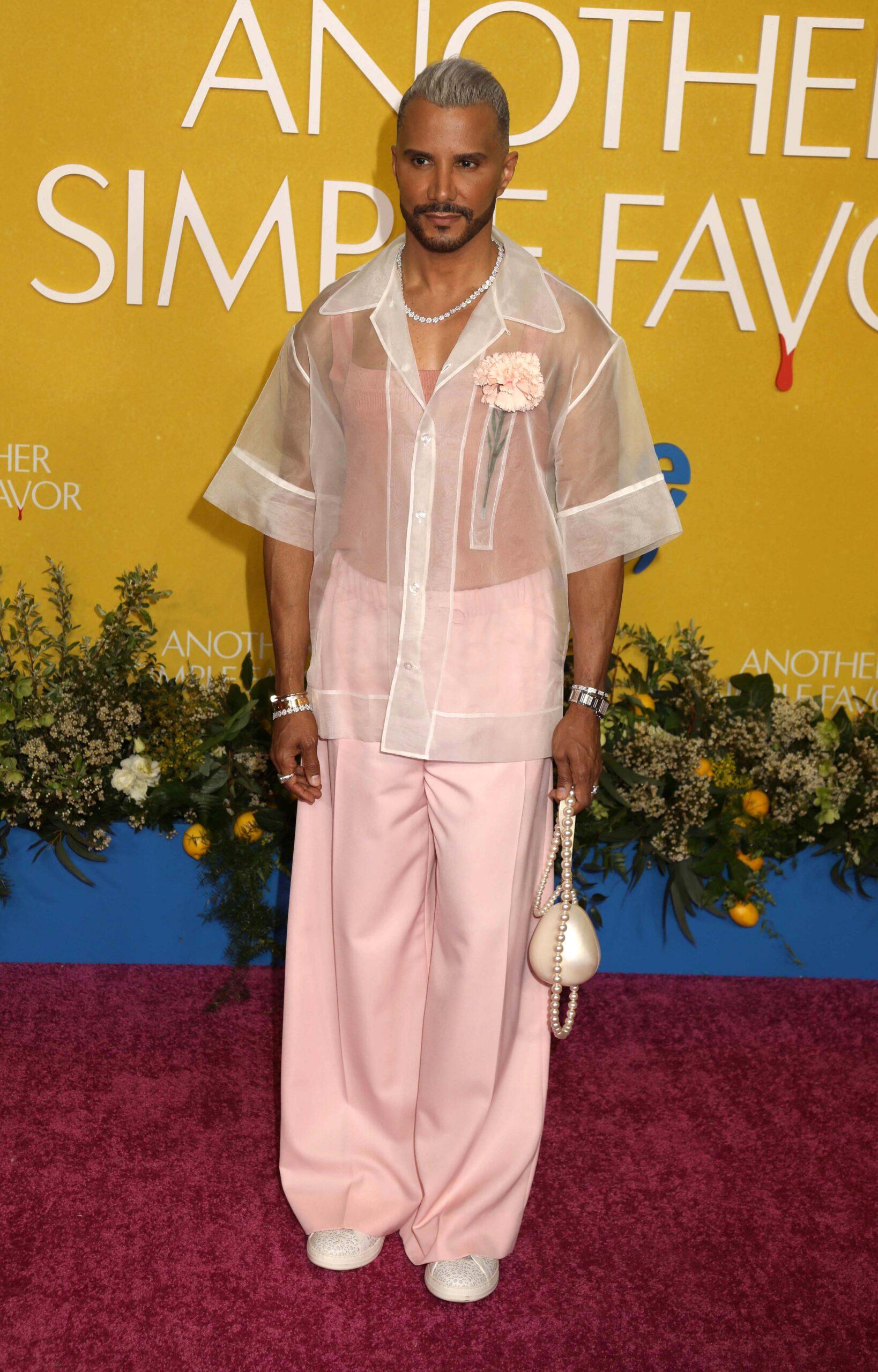 Jay Manuel posing on the red carpet. 