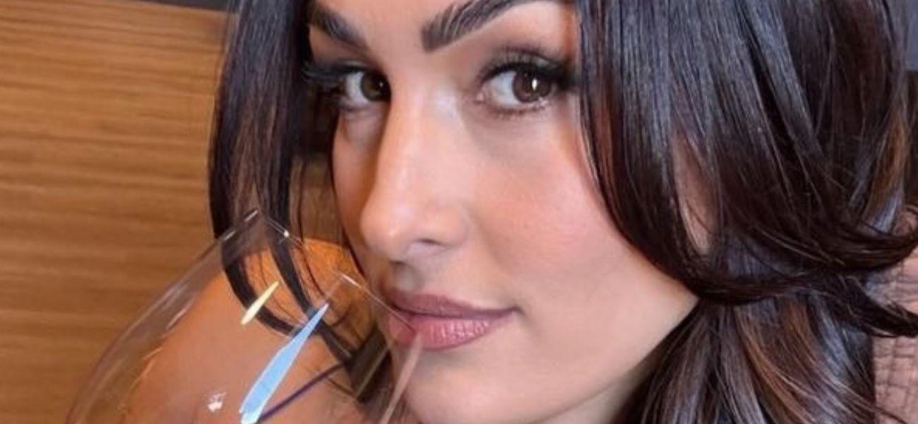Nikki Bella sipping on wine