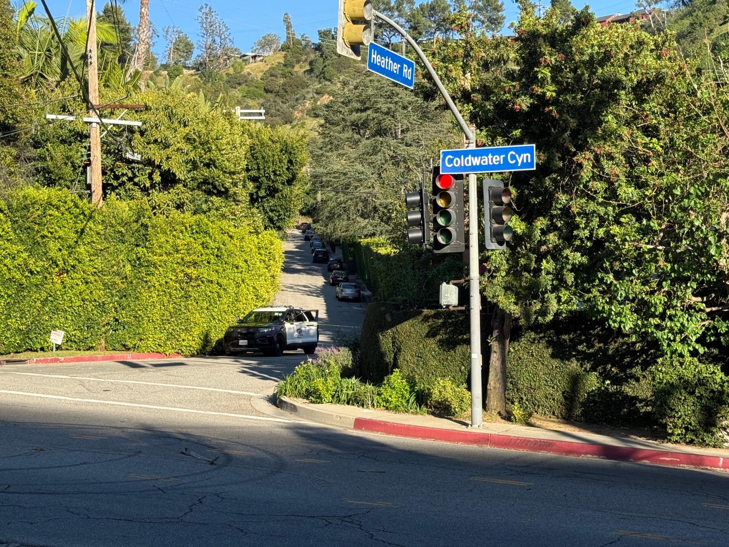 Police shut down the road outside of Rihanna's Beverly Crest home as it was struck by gunshots Sunday afternoon,