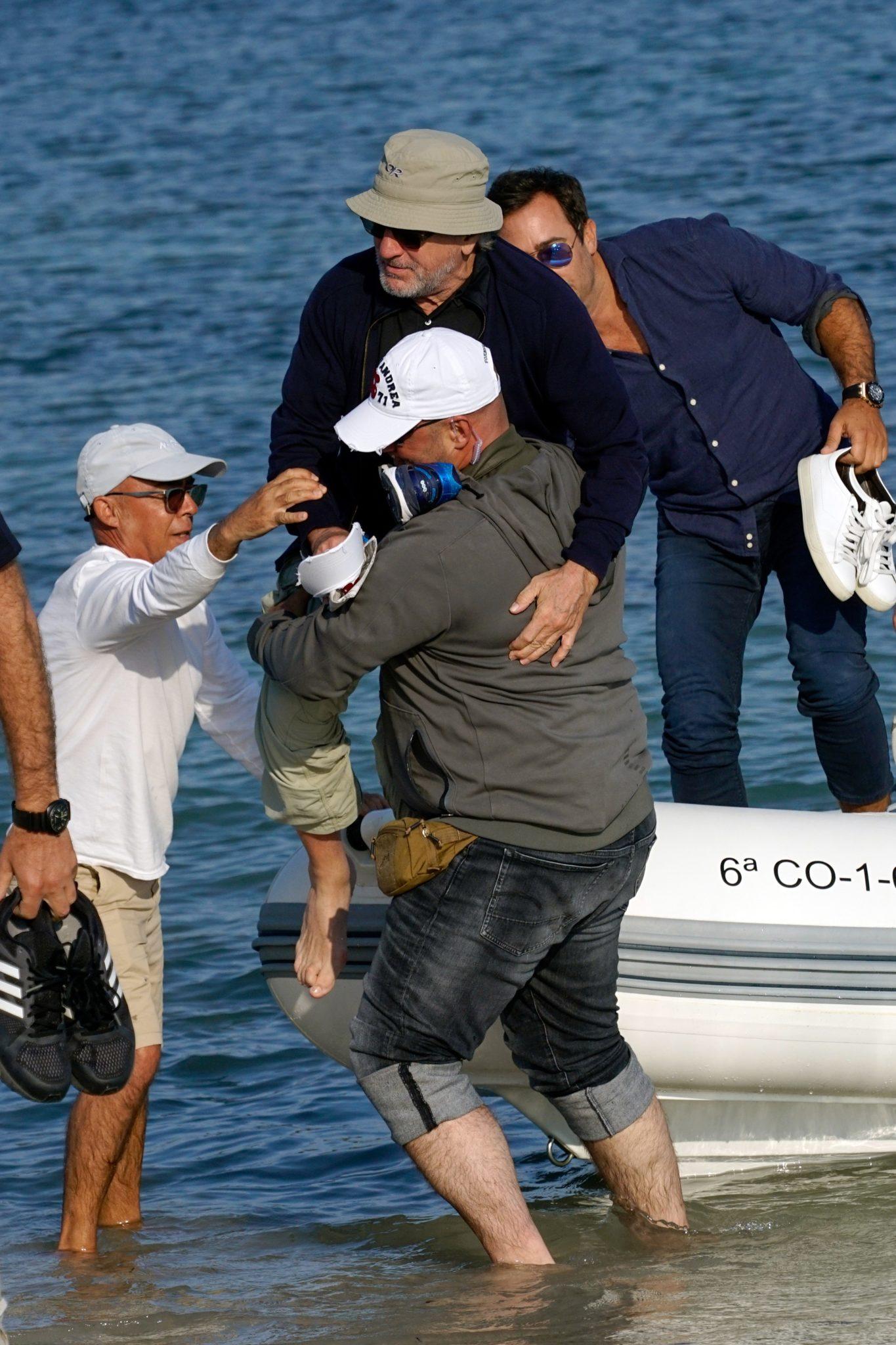 Robert De Niro getting carried off boat in Ibiza
