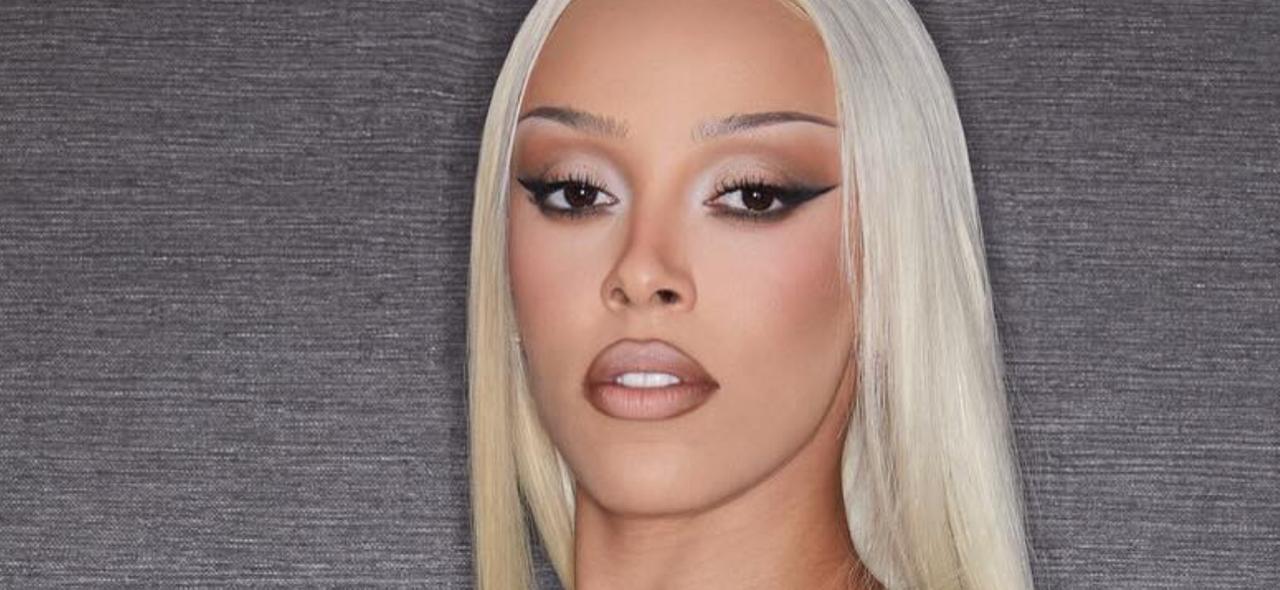 Doja Cat Exposes Chest In Sheer White Swimsuit